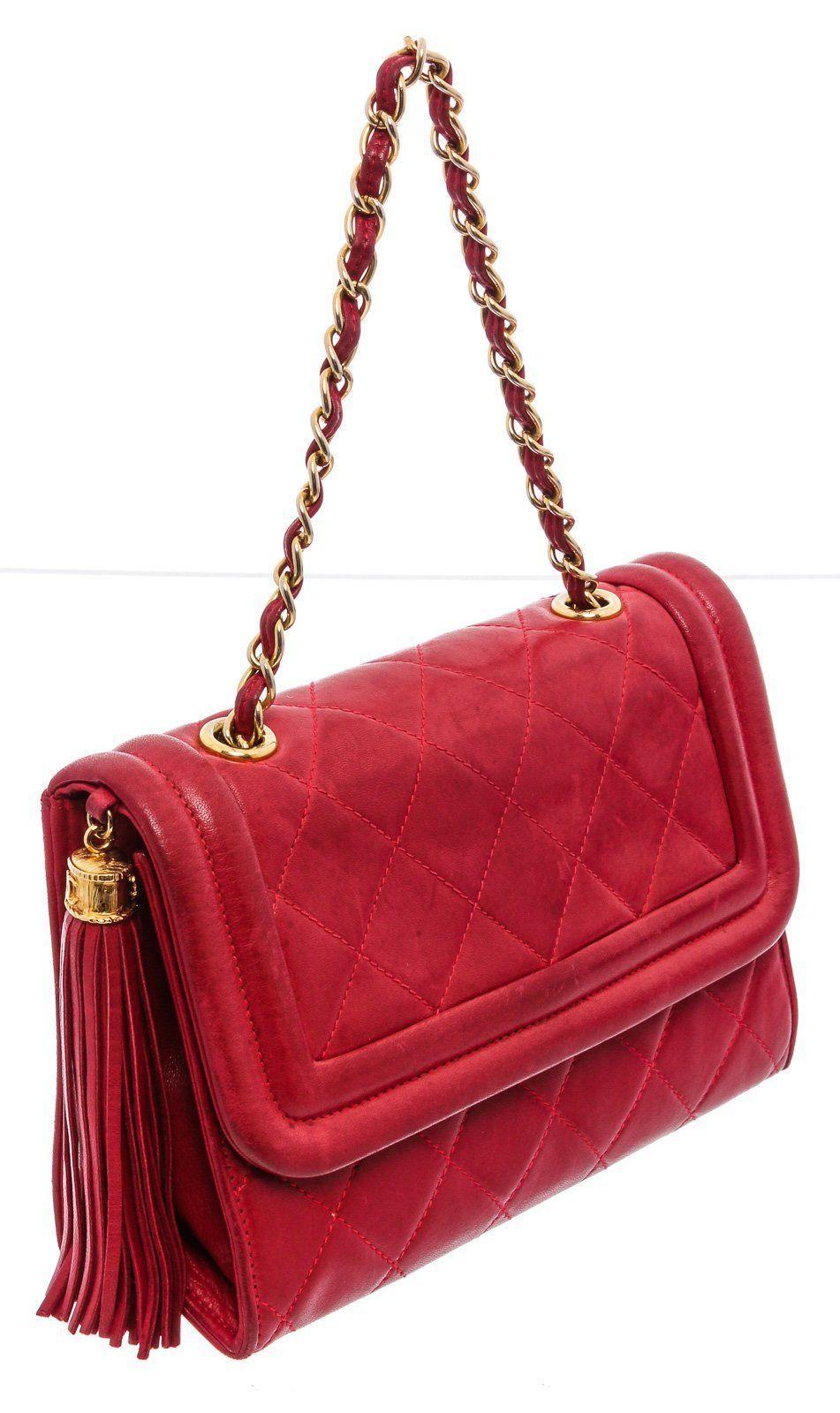 Red quilted vintage Chanel camera bag with gold-tone hardware, single chain-link and leather shoulder strap, tonal leather lining, single zip pocket at interior and flap closure.

20911MSC

	• Camera Bag

MEASUREMENTS:
	7.5 7.5 in / 19 cm
	2.5 2.5