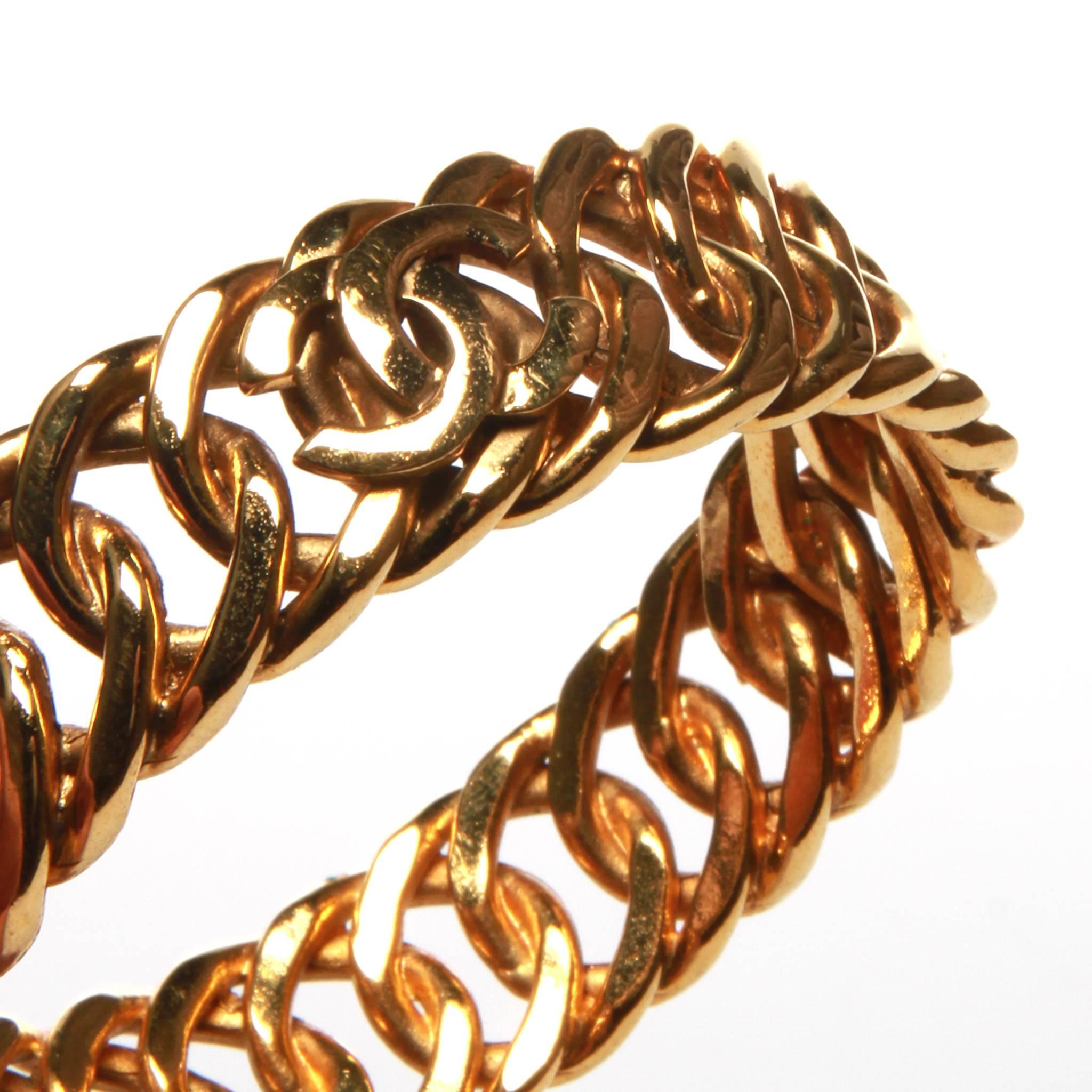 Chanel vintage bangle bracelet featuring a rigid chain design with 3 interlocking CC accents. 

