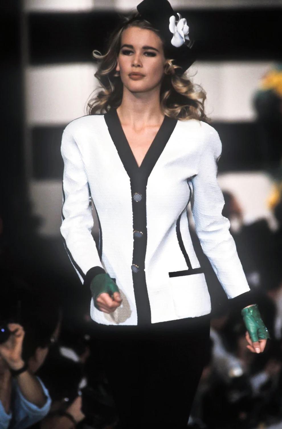 Presenting an exquisite runway masterpiece from CHANEL's Spring/Summer Collection of 1991. This piece is a rare gem for collectors, famously worn by Claudia Schiffer, Christy Turlington, and the esteemed Anna Wintour. Its significance transcended