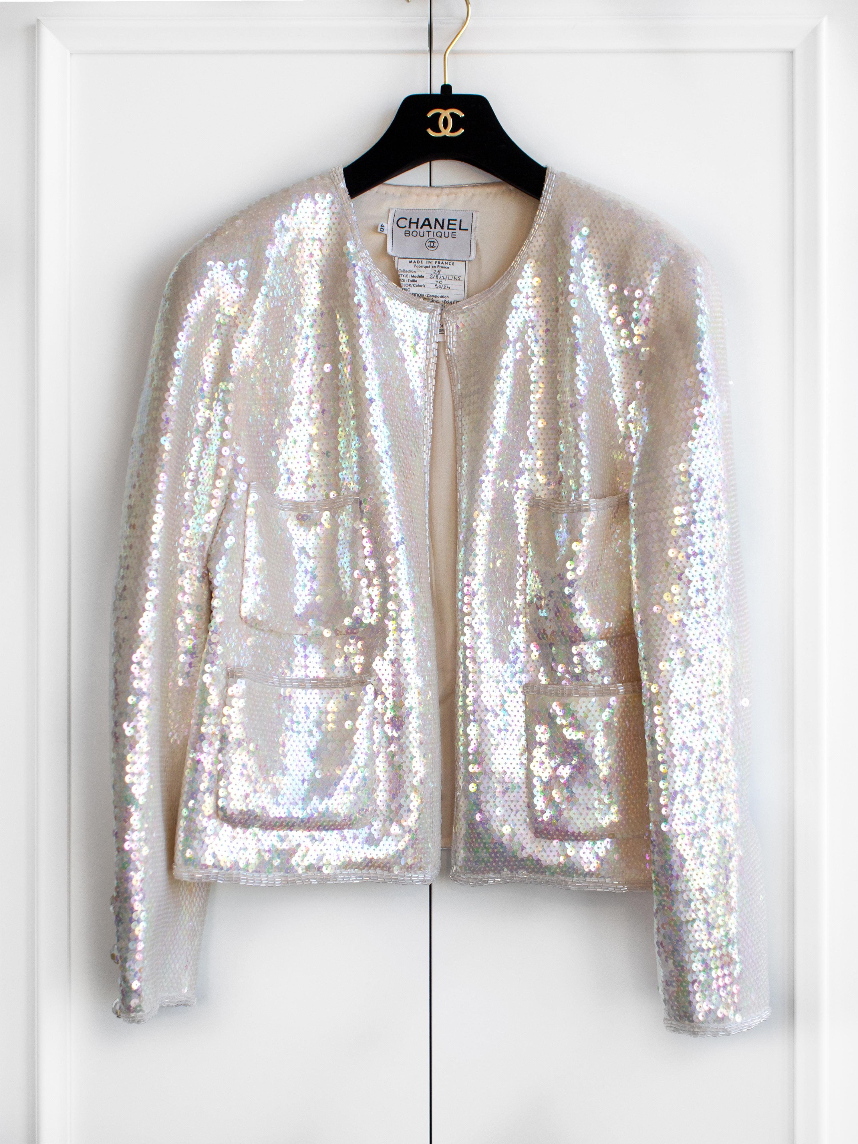 Introducing the iconic Chanel Spring/Summer 1992 iridescent sequin jacket, a rare piece coveted by collectors. This exquisite piece, famously worn by supermodels Claudia Schiffer, Naomi Campbell and Tatiana Patitz, showcases the timeless elegance of