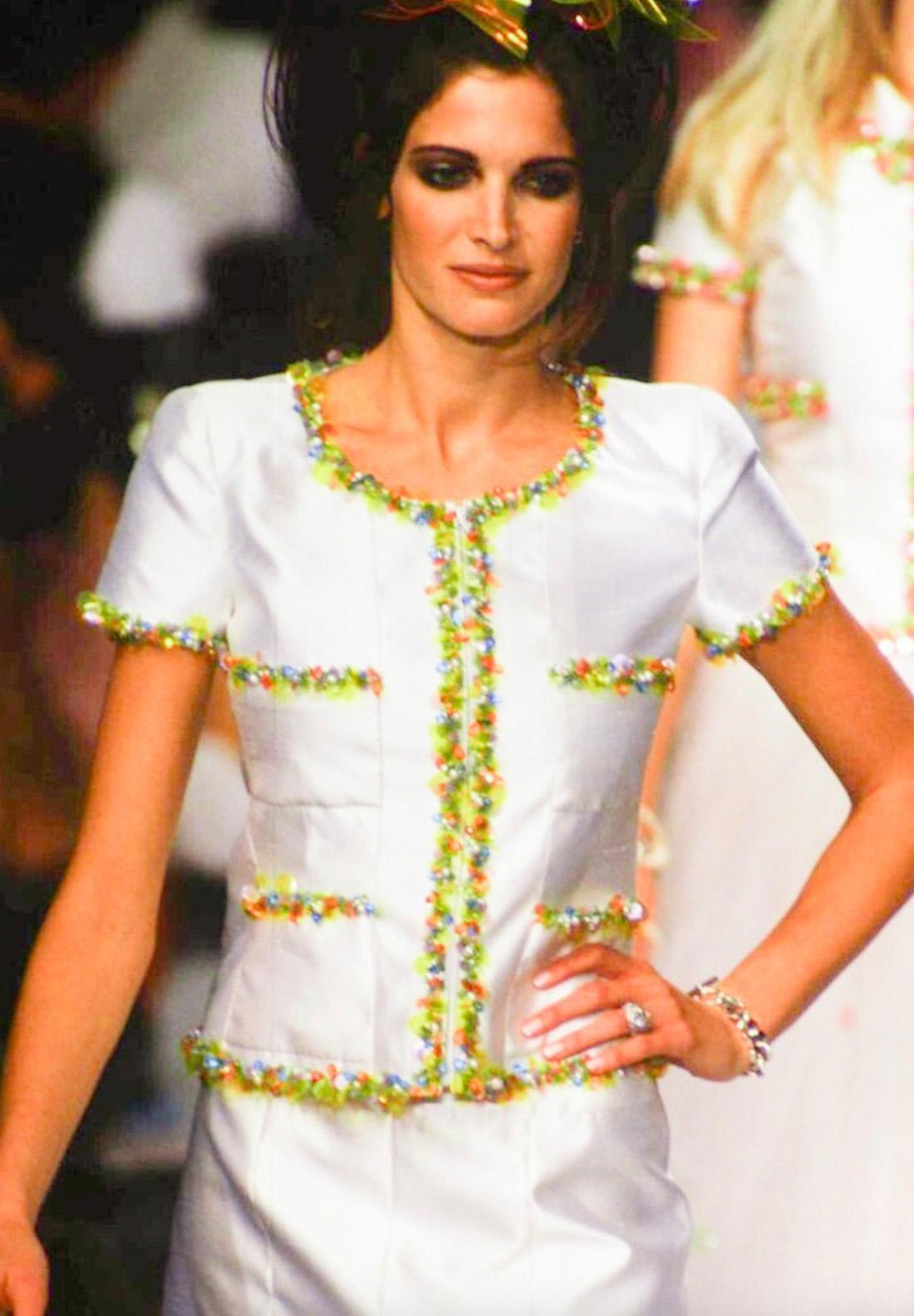 This vintage Chanel suit from the Spring/Summer 1996 collection is a striking example of Karl Lagerfeld’s playful yet sophisticated design aesthetic. A variation of this suit seen on Fran Fine in Season 3, Episode 27 of The Nanny. 
Crafted from