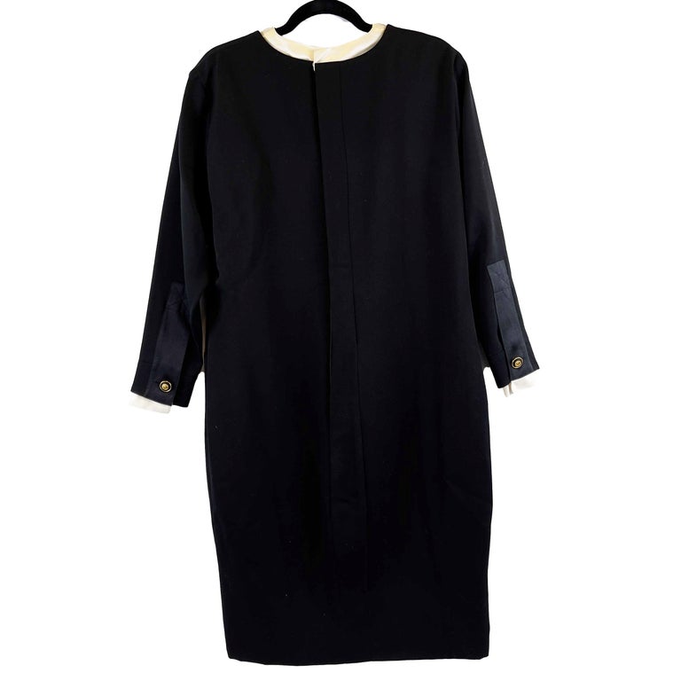 CHANEL - Vintage Satin Layer Trim Bow Shift Wool Dress - Black - Size FR / US 8

Description

This dress is crafted in black wool with satin cream layered trim at the neck and wrists.
Coco Chanel effigy coin style buttons adorn the front and