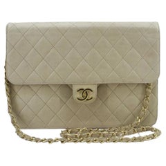 Chanel Vintage shoulder bag is crafted in beige quilted Lambskin leather, gold