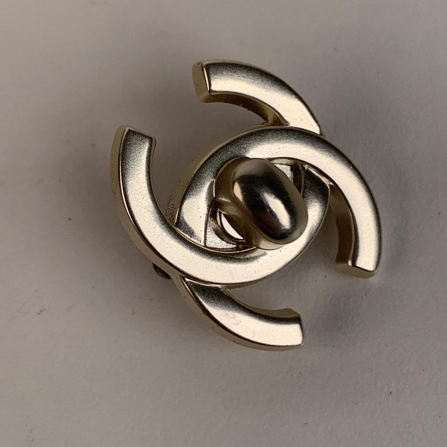 Add instant glamour to your outfit with this statement vintage Turnlock CC earrings by CHANEL, from the 1990s. Clip on closure on the back and  'CHANEL - 96 CC P - Made in France' oval  tag on the reverse of the earrings. Max width: 1. inch - 2,6