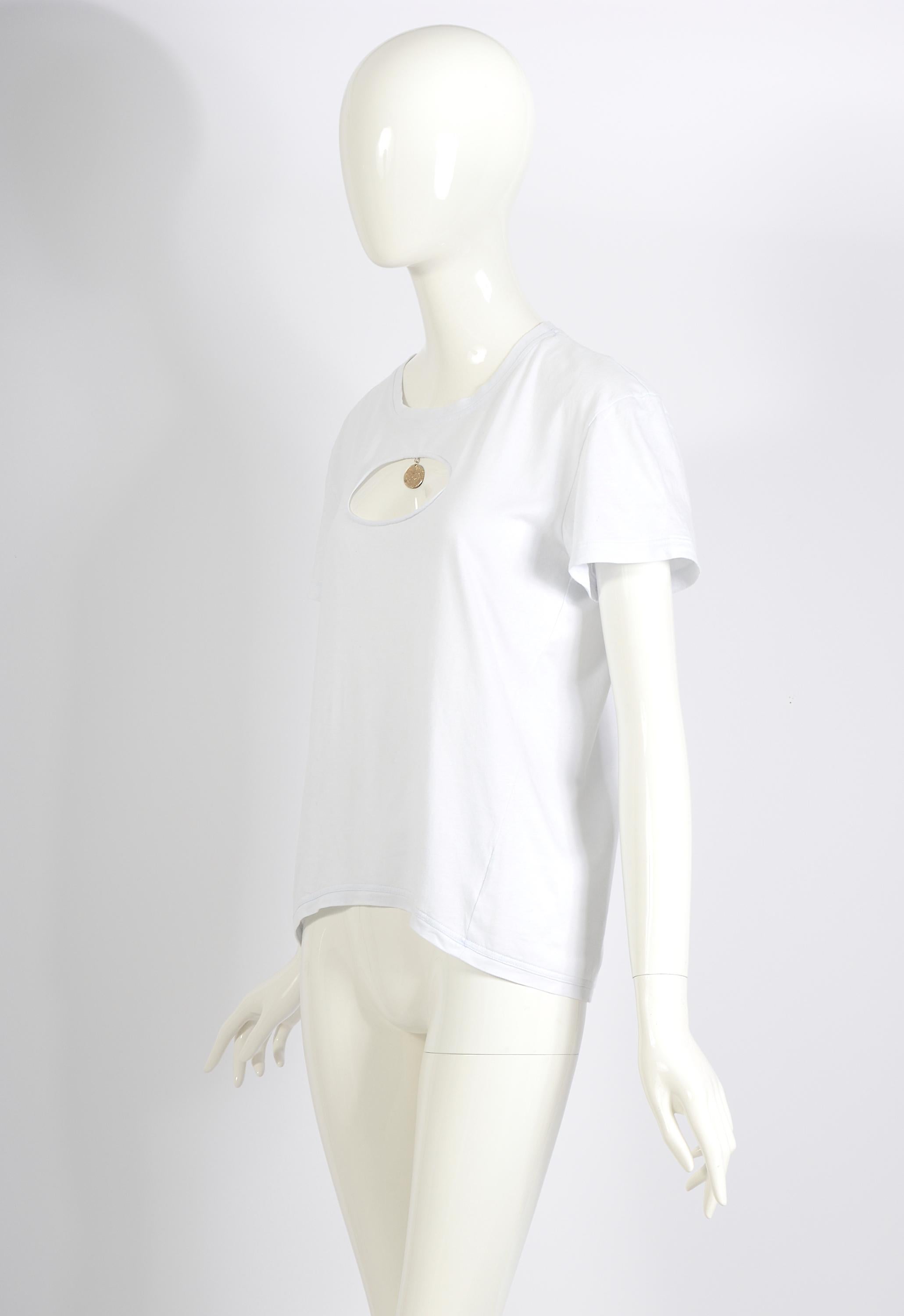Chanel by Karl Lagerfeld T-shirt from the Spring 2007 Runway collection. This unisex T-shirt features a front cutout with a thin gold medallion charm, approximately the size of a quarter, hanging within the cutout. The medallion is inscribed with