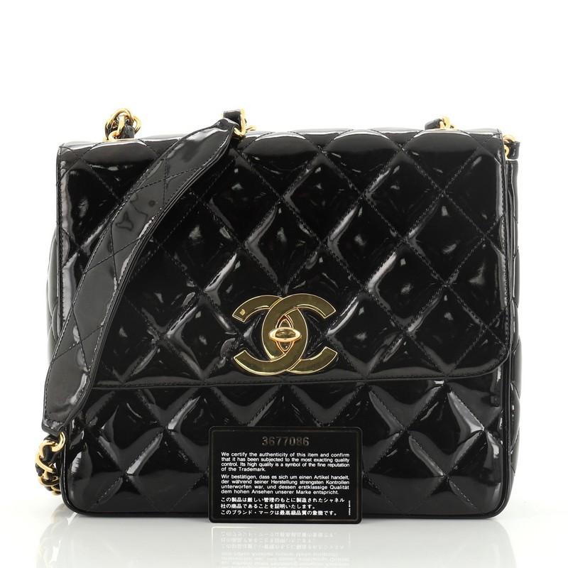 This Chanel Vintage Square CC Flap Bag Quilted Patent Medium, crafted from black quilted patent leather, features woven-in leather chain strap with leather pad and gold-tone hardware. Its flap with CC turn-lock closure opens to a black leather