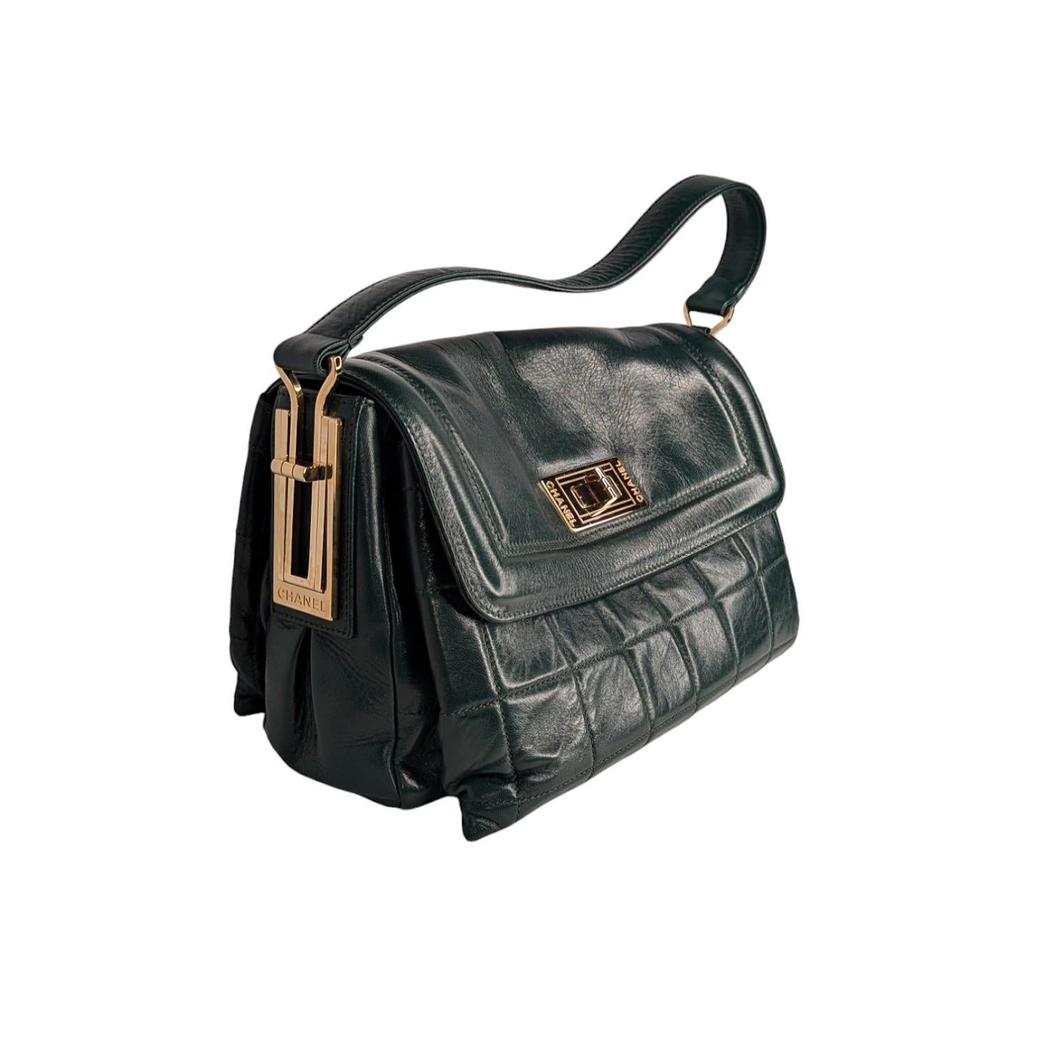 Dark Green quilted lambskin Chanel Square Mademoiselle Flap bag with gold-tone hardware, single flat shoulder strap, three interior compartments; camel satin lining, single zip pocket at interior wall and Mademoiselle turn-lock closure at front