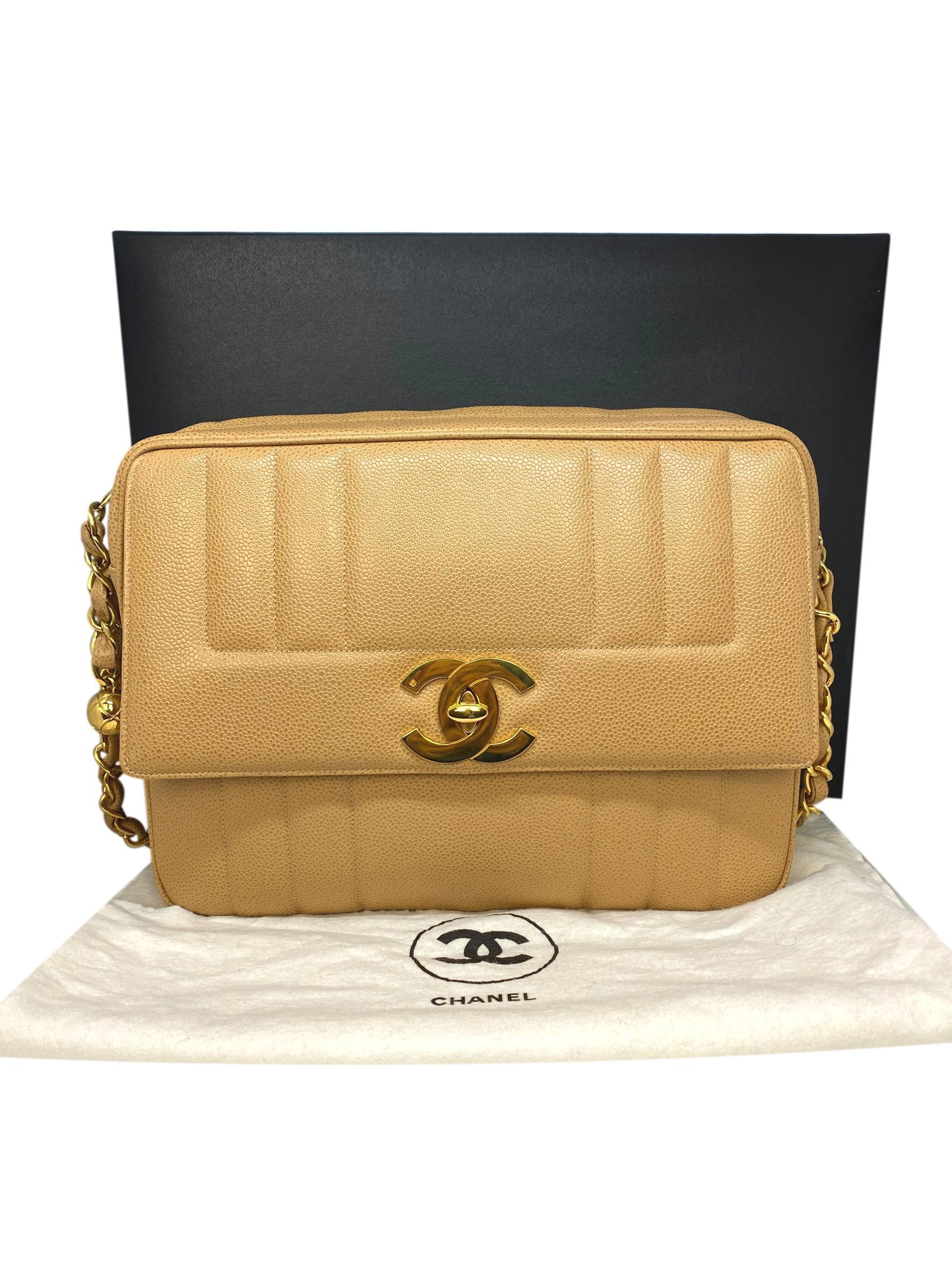 Chanel Vintage Tan Caviar Leather Camera Crossbody Bag with Gold Hardware. This highly coveted and rare collectible crossbody camera bag was produced between 1994 - 1996, baring a serial code of 