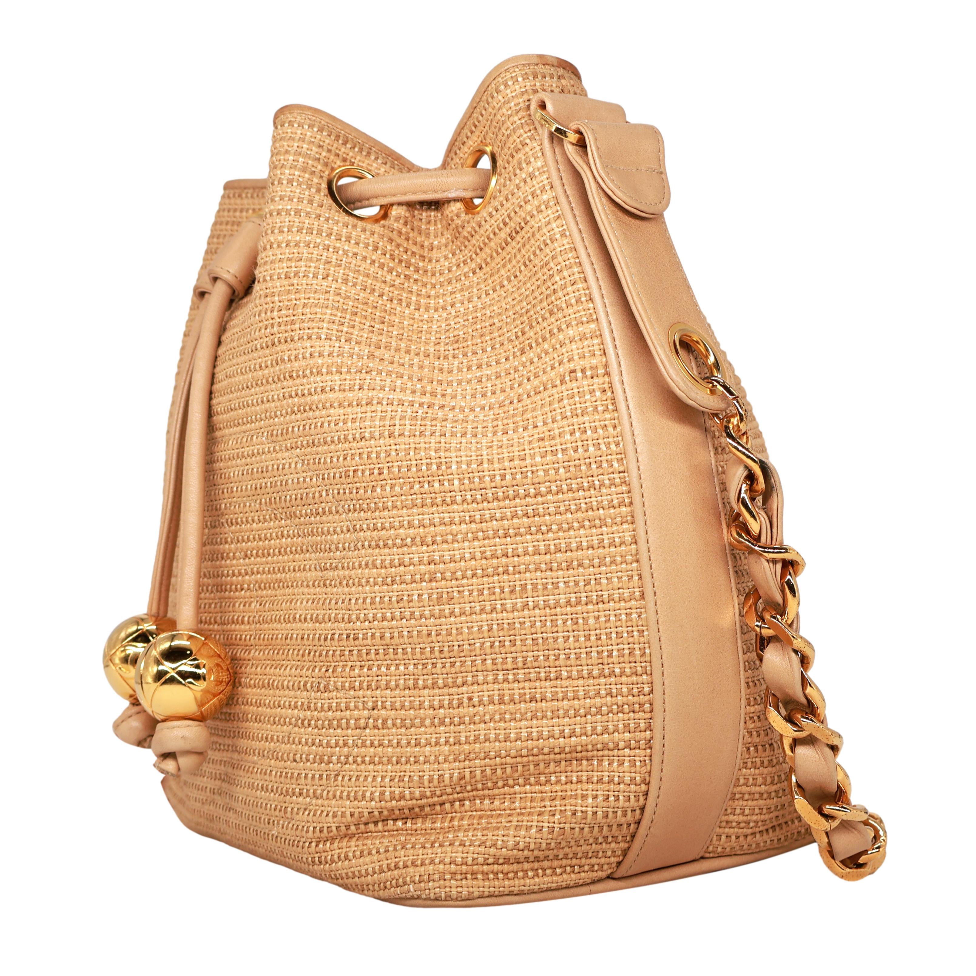 Chanel Vintage Tan Woven Raffia and Leather Drawstring Bucket Bag, 1992-1993. In Good Condition For Sale In Banner Elk, NC