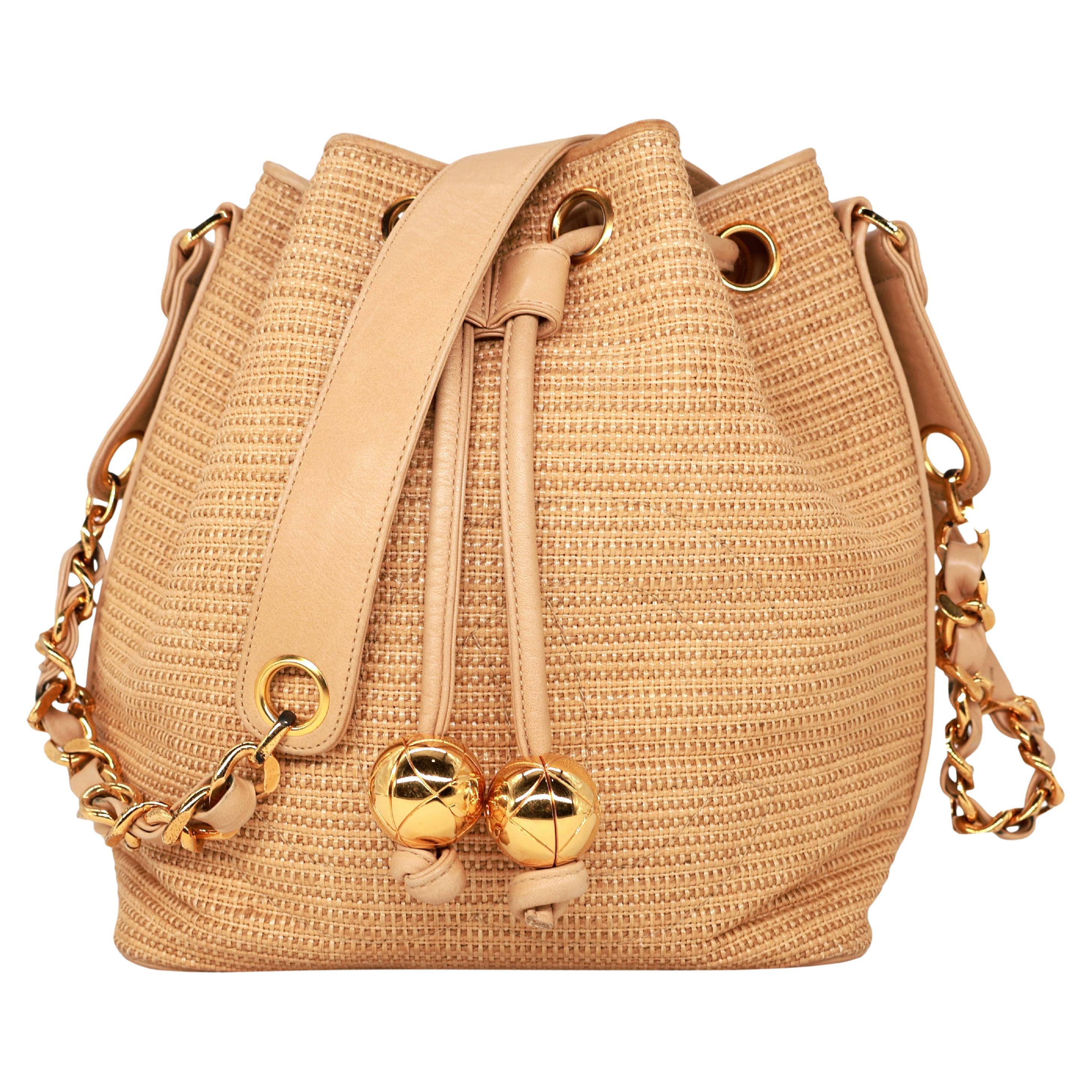 Chanel Vintage Tan Woven Raffia and Leather Drawstring Bucket Bag, 1992-1993. For Sale
