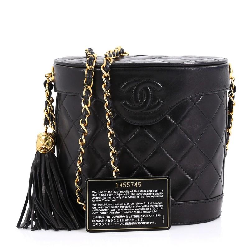 This Chanel Vintage Tassel Box Bag Quilted Leather Small, crafted from black diamond quilted leather, features woven-in leather chain strap, rounded and free-standing silhouette and gold-tone hardware. Its hidden snap closure opens to a black