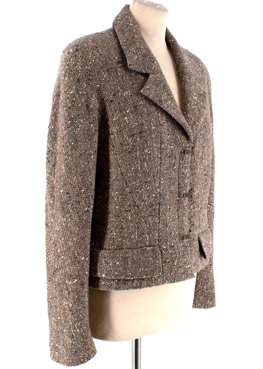 Chanel Taupe Wool Blend Tweed Jacket

-Made of a soft wool blend 
-Signature tweed texture 
-Classic cut
-Branded Clasp fastening to the front 
-CC logo branding to the lining
-Faux pocket details to the front
-Luxurious silk lining
-Chain to the