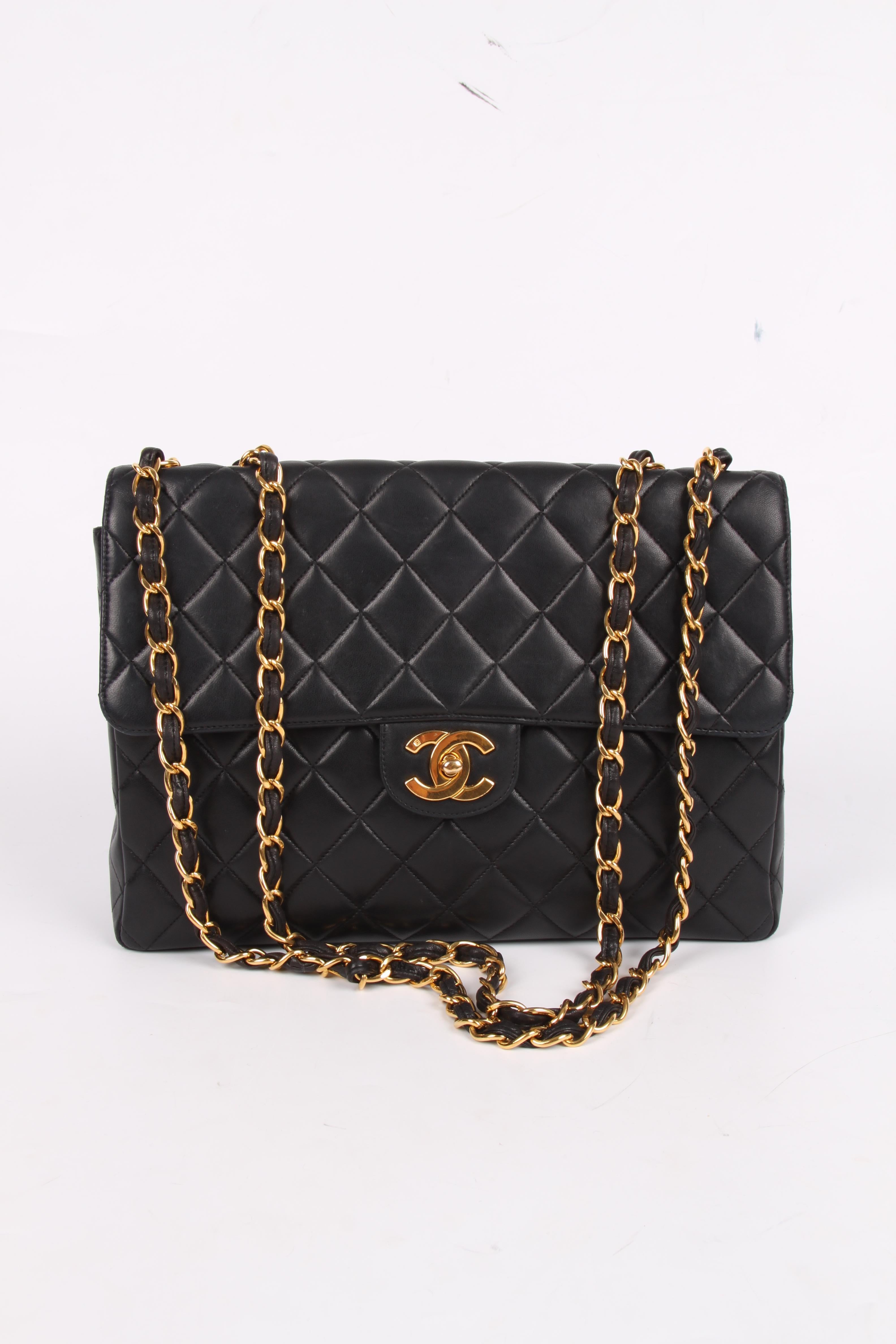 A vintage classic by Chanel: the Timeless Jumbo Flap Bag in black lambskin leather.  

This 2.55 Jumbo Timeless Flap Bag is from 1994-1996 and its the larger size of this classic model. It measures as much as 30 centimeters in length.

A chunky