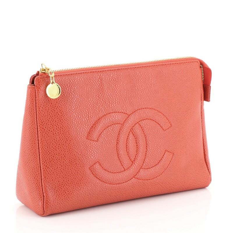 This Chanel Vintage Timeless Toiletry Pouch Caviar, crafted in red caviar leather, features stitched CC logo and gold-tone hardware. Its zip closure opens to a neutral leather interior with zip pocket. Hologram sticker reads: 5075128.

Condition:
