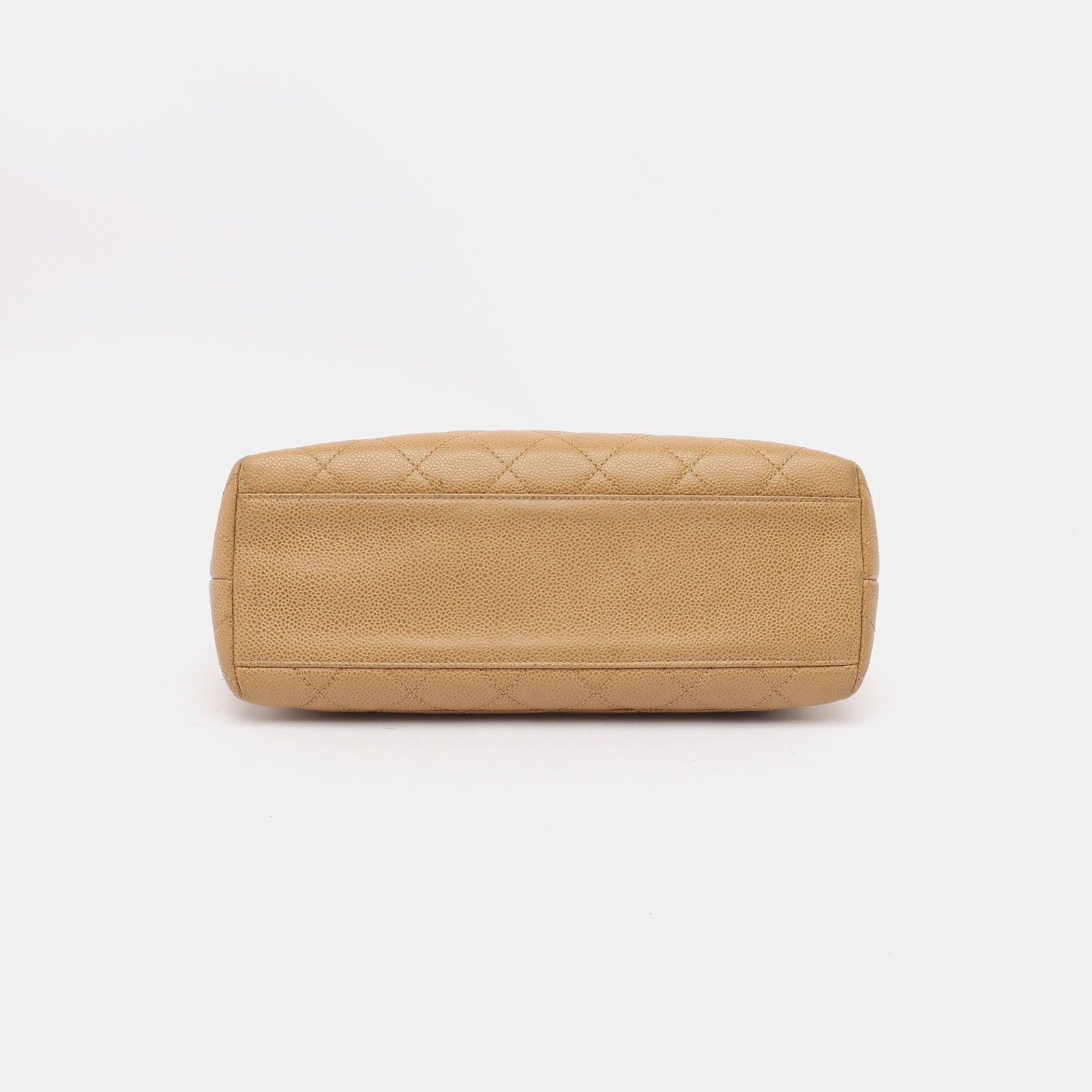 Chanel Vintage Top Handle Kelly Beige Flap Bag Caviar Leather 24k Gold Plated Hardware, 2000
 These are professional photos of the actual bag.
 Unleash your inner icon with this exquisite Vintage Chanel Beige Quilted Caviar Top Handle Kelly Flap Bag