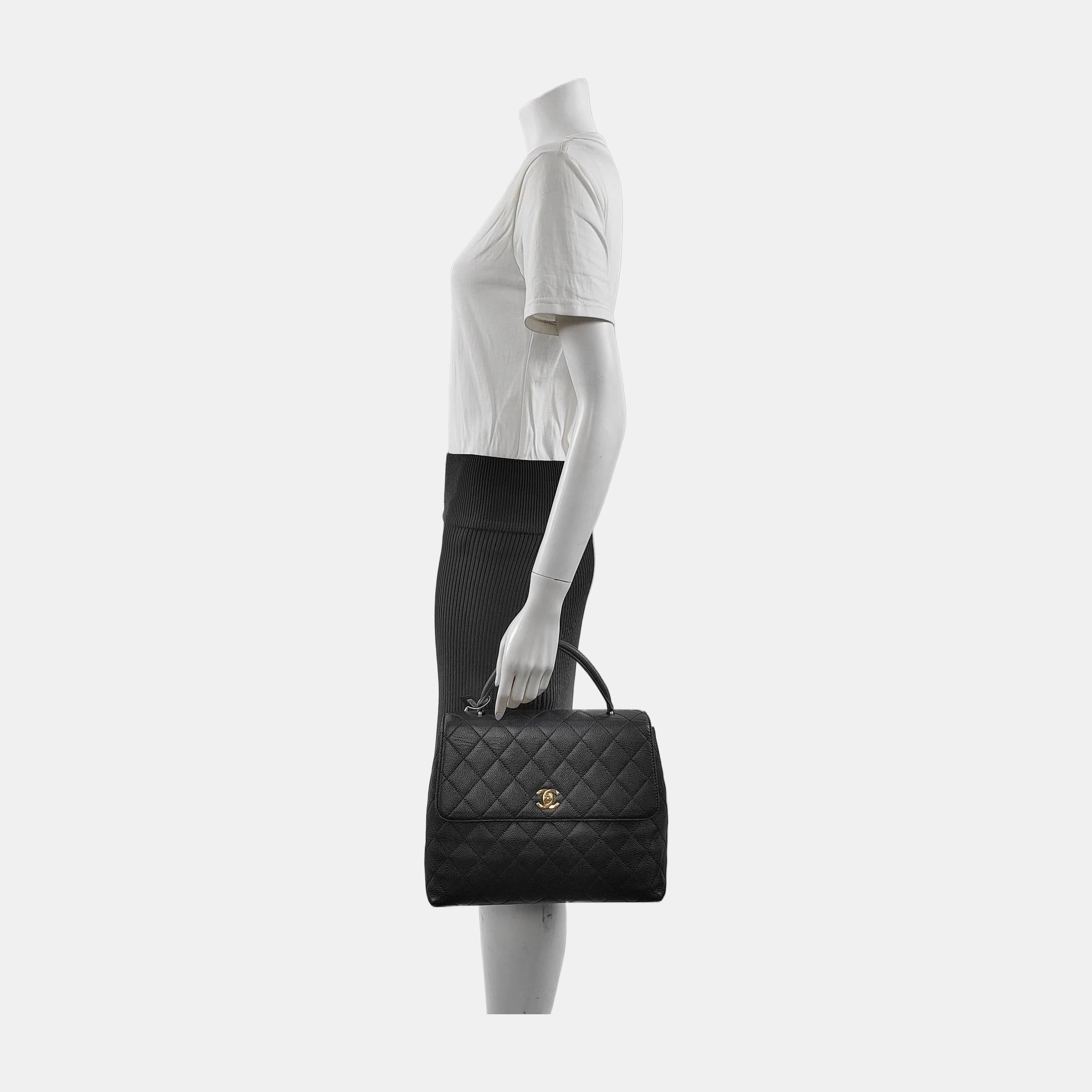 Unleash your inner icon with this exquisite Vintage Quilted Caviar Top Handle Kelly Flap Bag (2000-2002). Immerse yourself in the unparalleled luxury of supple caviar leather, flawlessly sculpted into the timeless Kelly boxy shape. A coveted
