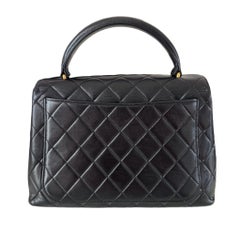 Chanel Vintage Top Handle Kelly Schwarze Klappentasche aus Lammfell Leder 24k Gold HW