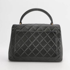 Chanel Vintage Top Handle Kelly Schwarze Klappentasche aus Lammfell Leder 24k Gold HW