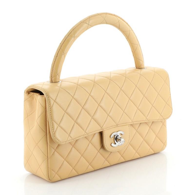 Condition: Damaged. Repainted exterior. Creasing, bubbling and wear on exterior and underneath flap, minor wear in interior, scratches on hardware. 
Accessories: No Accessories 
Measurements: Handle Drop 3.5