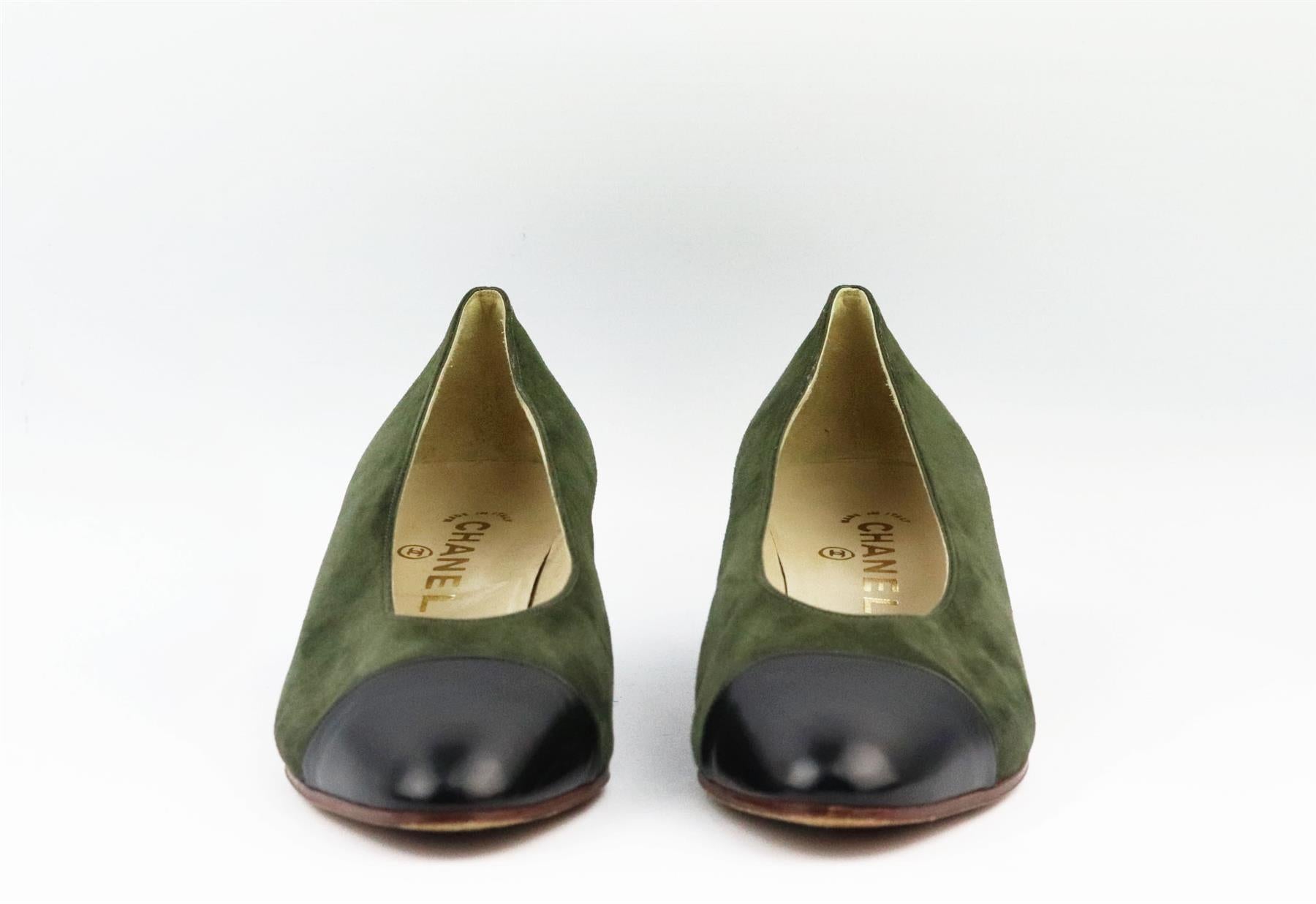 These vintage pumps by Chanel are always stand out pieces, even designs as classic as these shoes, made in Italy from green suede and black leather toe cap that are balanced out with an almond toe. Sole measures approximately 38 mm/ 1.5 inches.