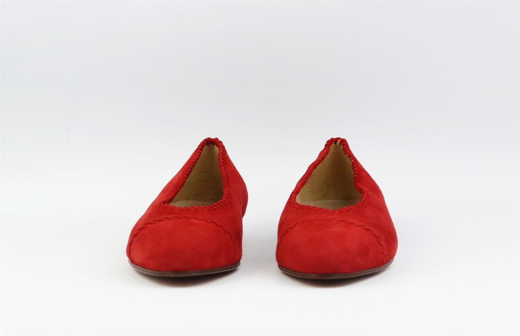 These vintage ballerina flats by Chanel are always stand out pieces, even designs as classic as these flats, made in Italy from red suede that are balanced out with an almond toe and finished with whipstitched detail. Sole measures approximately 10