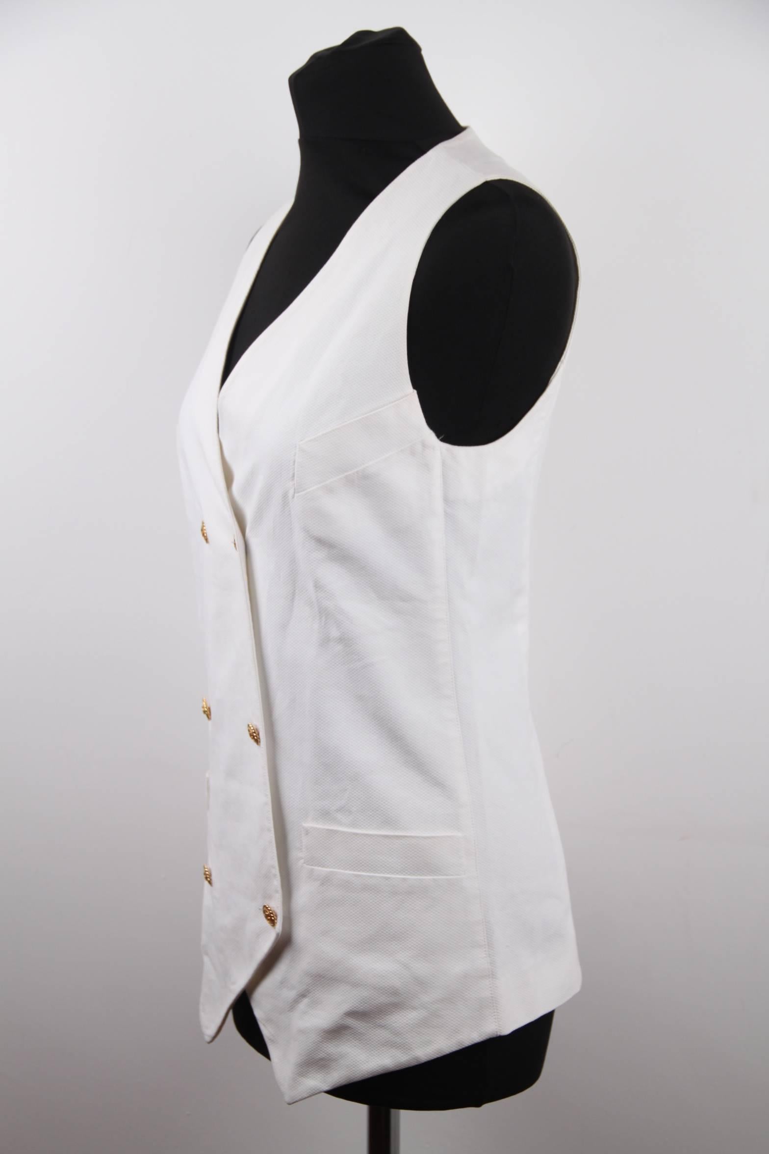 Chanel Vintage White Double Breasted Vest Waistcoat with Logo Buttons

Model: Vest
Material: Cotton
Color: White
Gender: Women
Country of Manufacture: France
Size: Medium

Approx. measurements:
- Armpit to armpit (flat): 15 1/2 inches - 39,4 cm
-