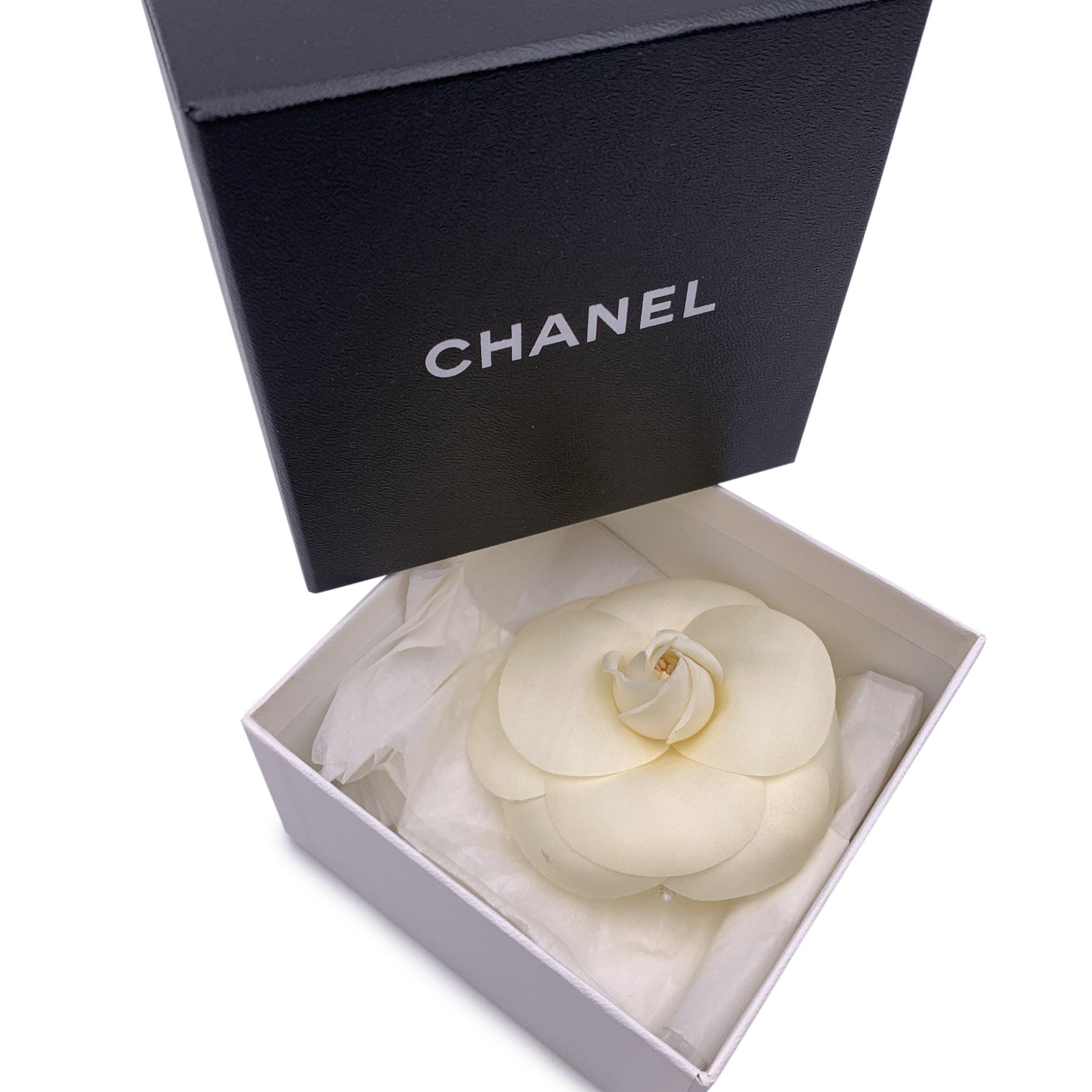 Chanel Vintage Camelia Camellia Flower Pin Brooch. White fabric petals. Safety pin closure. Max width: 3.5 inches - 8.9 cm. 'CHANEL - CC - Made in France' oval tab on the back Condition A - EXCELLENT Gently used. Chanel box included. Please check