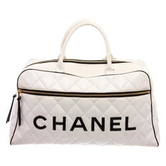 Chanel Vintage White Quilted Leather Black Logo Duffle Bag