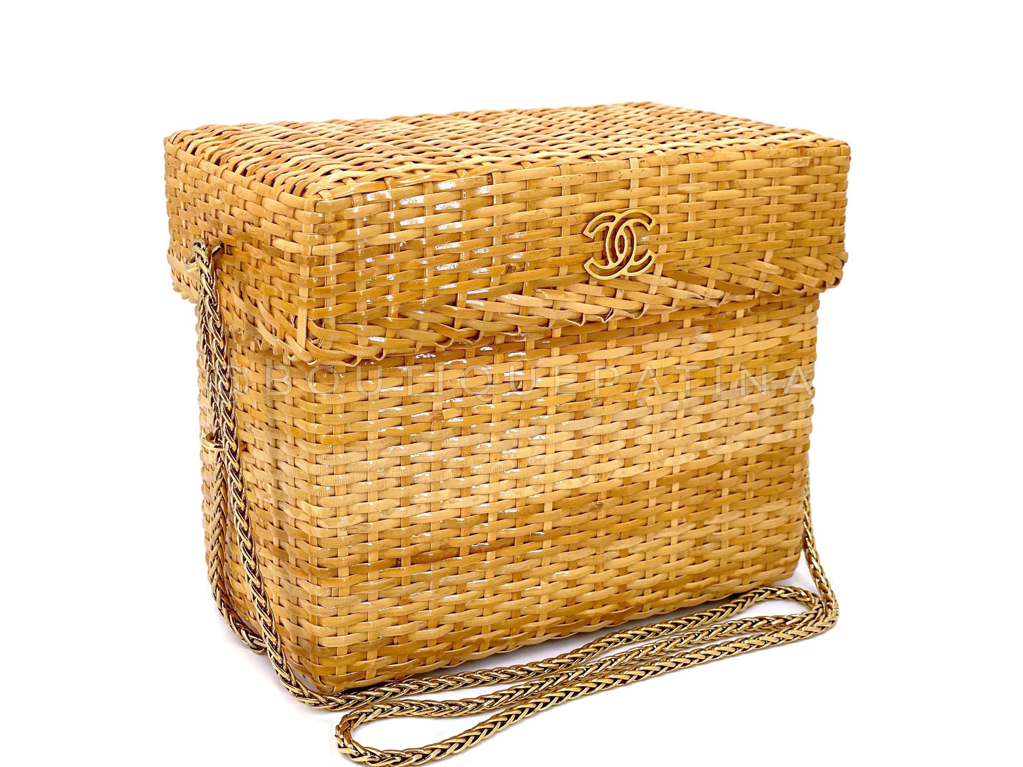 Store item: 67399
This Chanel Vintage Wicker Mini Picnic Basket Rattan Bag w Chain is a whimsical miniature picnic basket style two-piece box-shaped bag with a lid that is removable (but still attached via chain) to a leather-lined interior.

Sleek