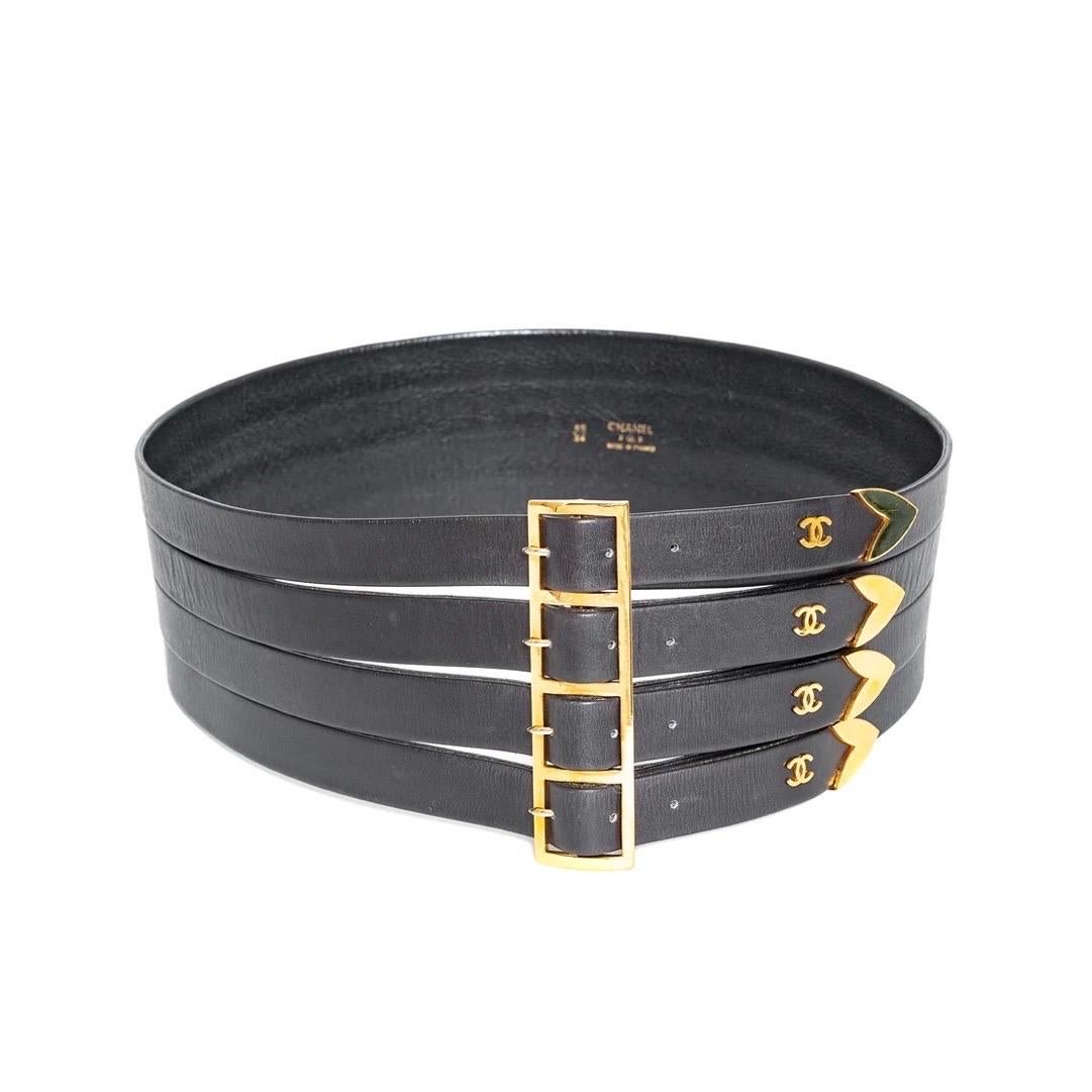 Chanel Vintage Wide Leather CC Belt

Fall/Winter '92–'93
Black
Gold-tone hardware
Cut out straps with four individual buckles
Interlocking CC studs on tips
Made in France
Leather
Excellent vintage condition; minor abrasions and wrinkling in leather