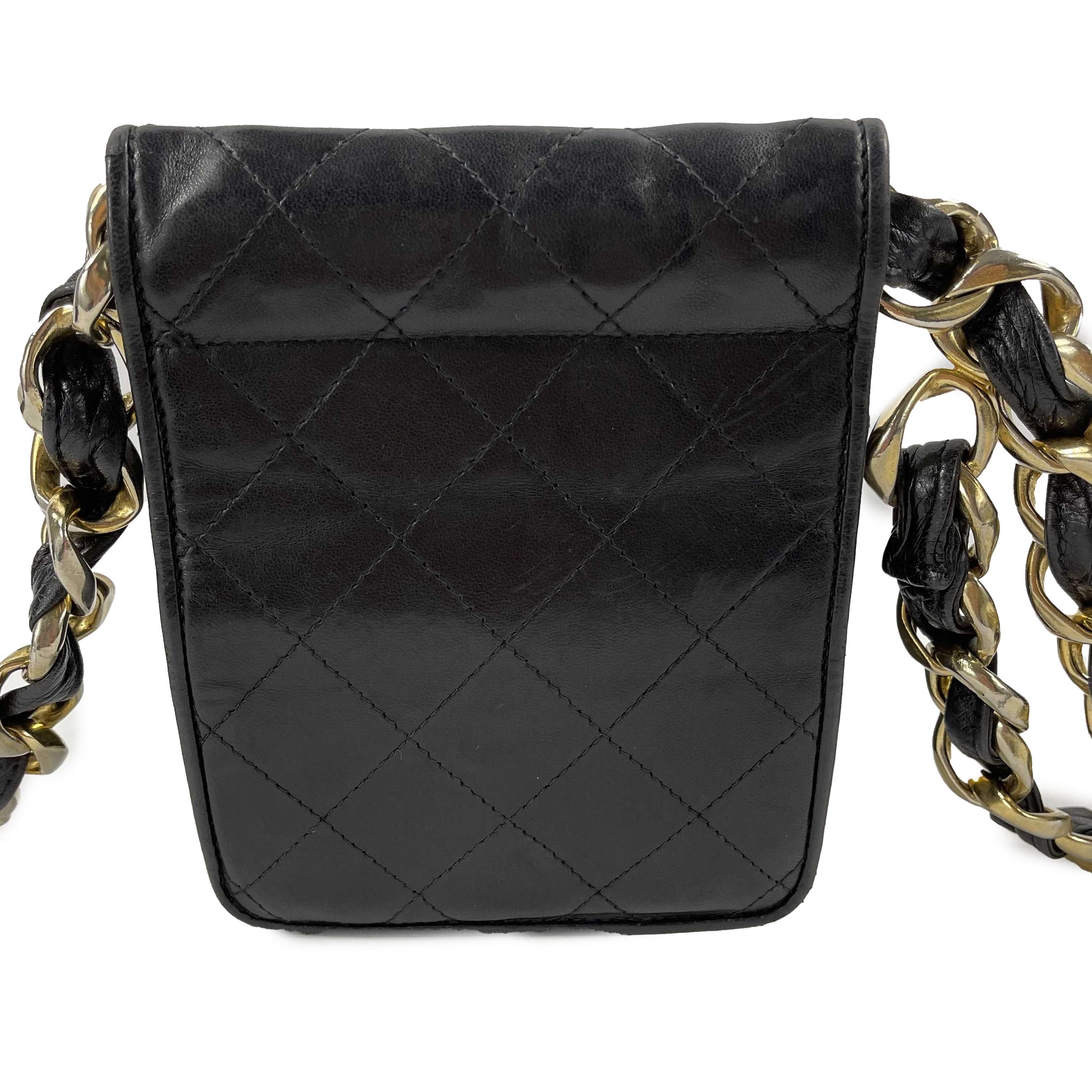 CHANEL - VTG 90s Black Quilted Leather CC Chain Belt Mini Bag / Fanny Pack 

Description

This Chanel belt bag was featured in an ad campaign on supermodel Claudia Schiffer in the early 1990's.
The bag is crafted with black quilted lambskin leather