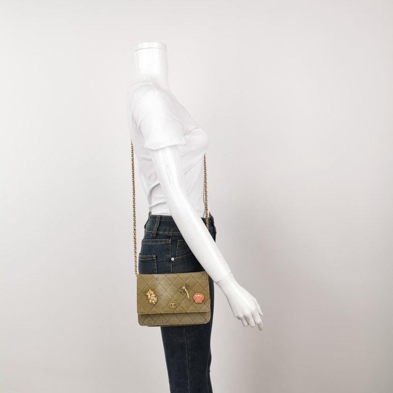 Chanel Wallet on Chain Khaki Quilted Canvas Coco Cuba Charms 2017 These are professional photos of the actual bag offered by Luxbags. This Chanel Wallet on Chain is a playful interpretation of the classic design. Crafted from Khaki Green Quilted
