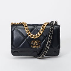 Chanel Wallet on Chain (WOC) 19 shoulder bag in black lambskin quilted leather