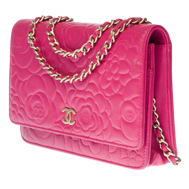 Chanel Wallet on Chain (WOC) Camelia shoulder bag in pink quilted