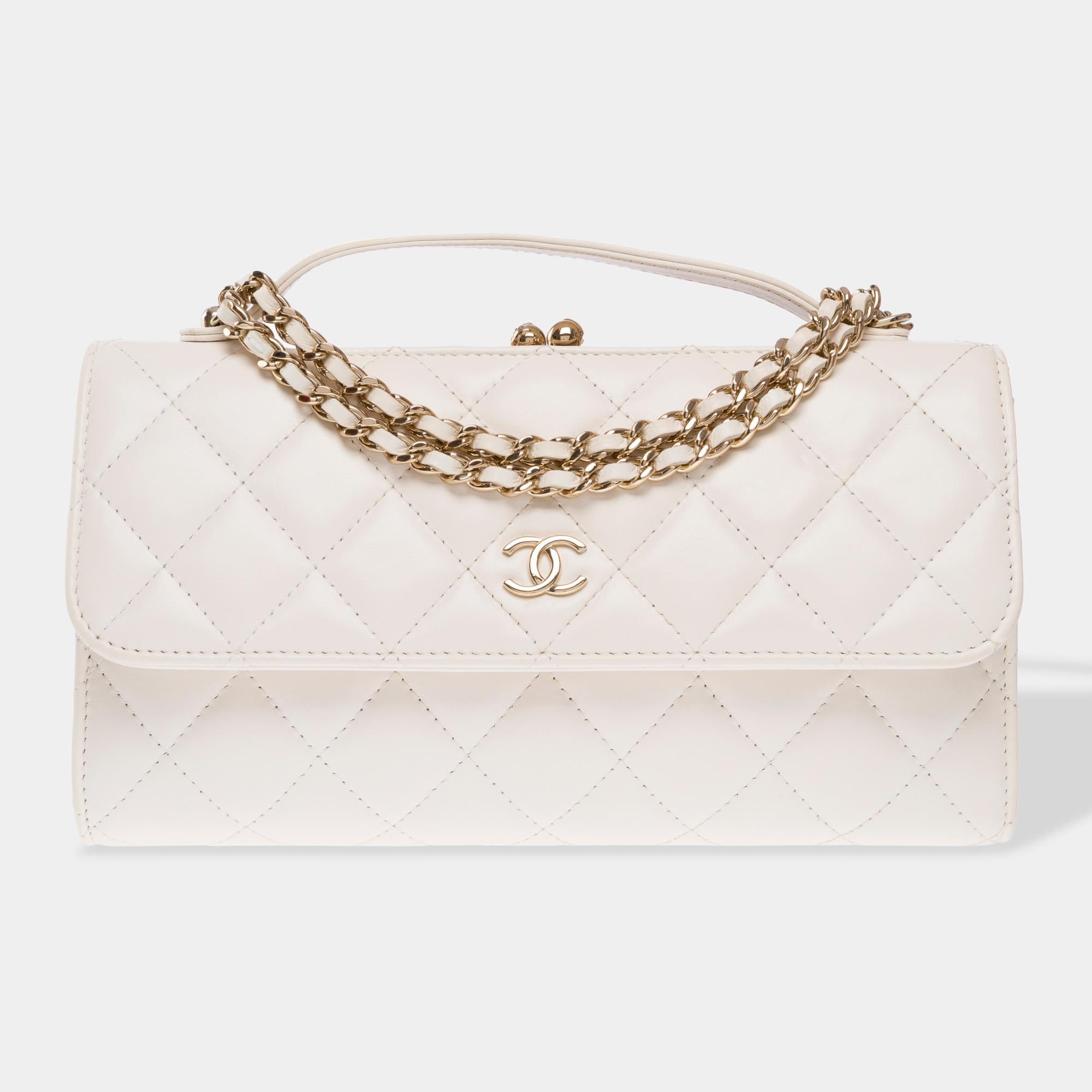 Splendid​ ​Chanel​ ​Classic​ ​flap​ ​Wallet​ ​On​ ​Chain​ ​(WOC)​ ​handle​ ​phone​ ​holder​ ​with​ ​chain​ ​shoulder​ ​bag​ ​in​ ​off-white​ ​quilted​ ​lambskinleather,​ ​champagne​ ​metal​ ​trim,​ ​a​ ​white​ ​leather​ ​handle,​ ​a​ ​champagne​