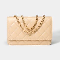 Portefeuille Chanel sur chaîne (WOC)  Sac à bandoulière beige matelassé Caviar