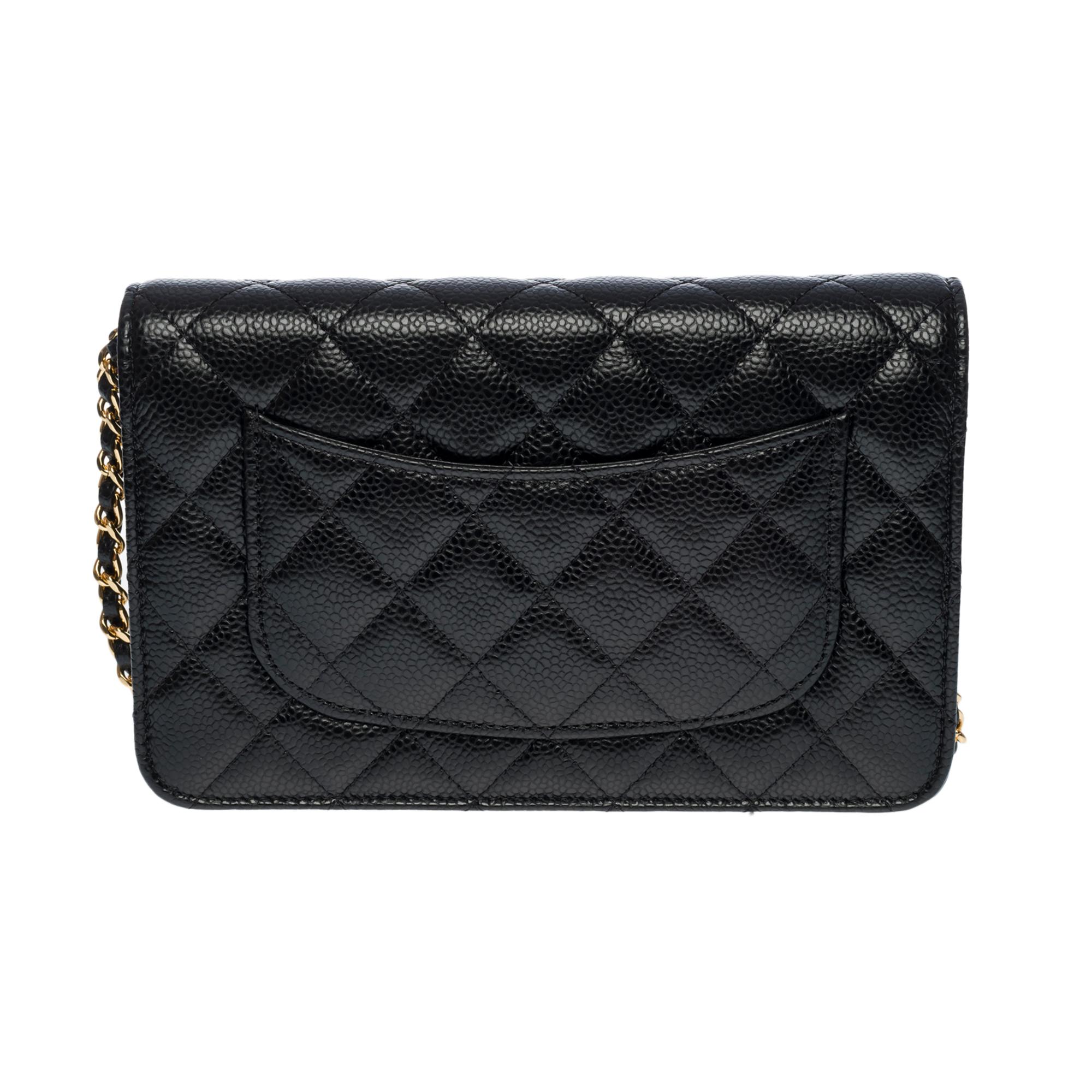 Black Chanel Wallet on Chain (WOC)  shoulder bag in black Caviar quilted leather, GHW