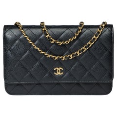 Used Chanel Wallet on Chain (WOC)  shoulder bag in Black quilted Caviar leather, GHW