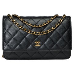 Used Chanel Wallet on Chain (WOC)  shoulder bag in Black quilted Caviar leather, GHW