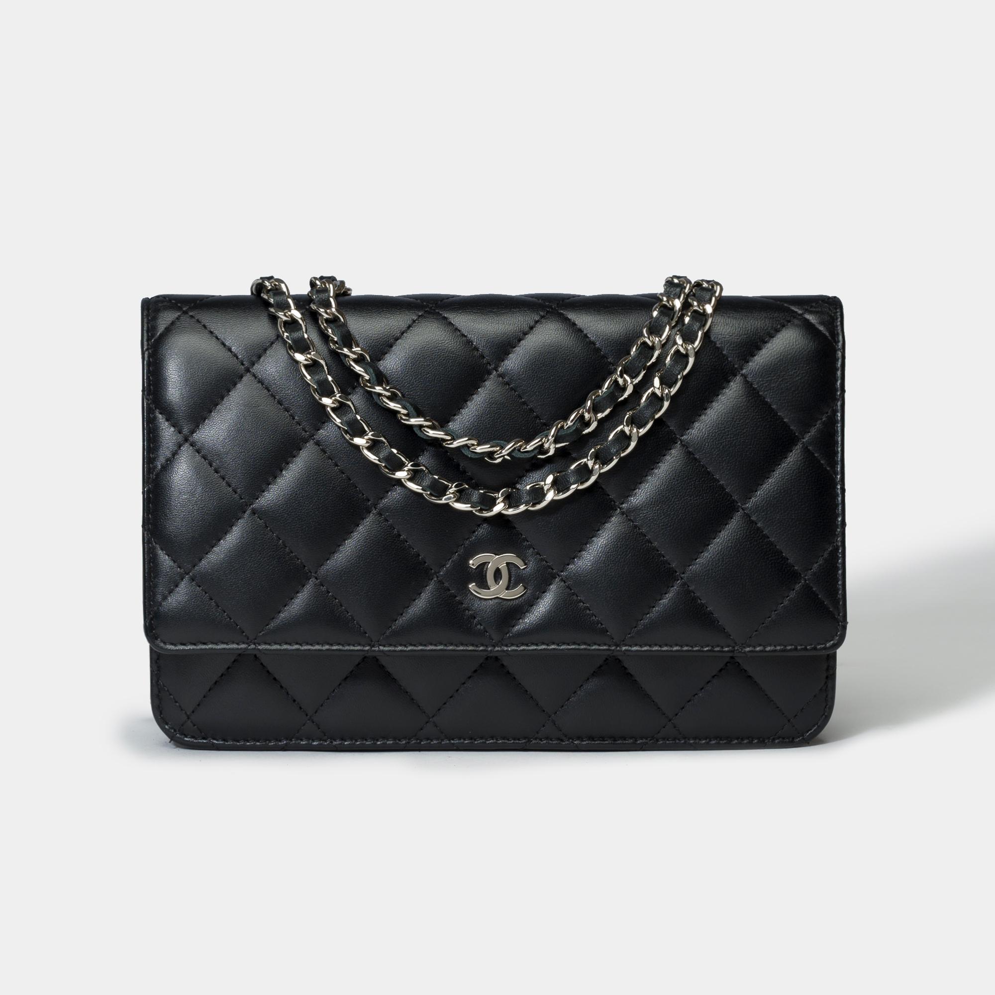 Gorgeous​ ​Chanel​ ​Wallet​ ​On​ ​Chain​ ​shoulder​ ​bag​ ​(WOC)​ ​in​ ​black​ ​quilted​ ​lambskin,​ ​silver​ ​metal​ ​trim,​ ​a​ ​silver​ ​metal​ ​chain​ ​interlaced​ ​with​ ​black​ ​leather​ ​allowing​ ​a​ ​shoulder​ ​or​ ​crossbody​ ​carry

A​