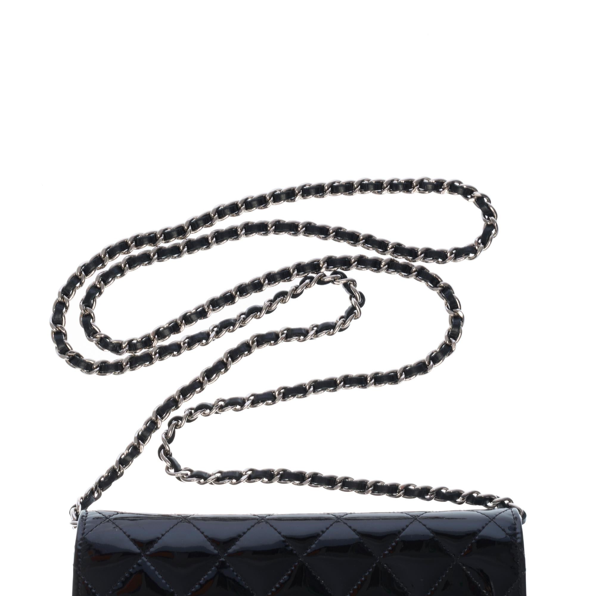 Women's Chanel Wallet on Chain (WOC) shoulder bag in black quilted patent leather, SHW