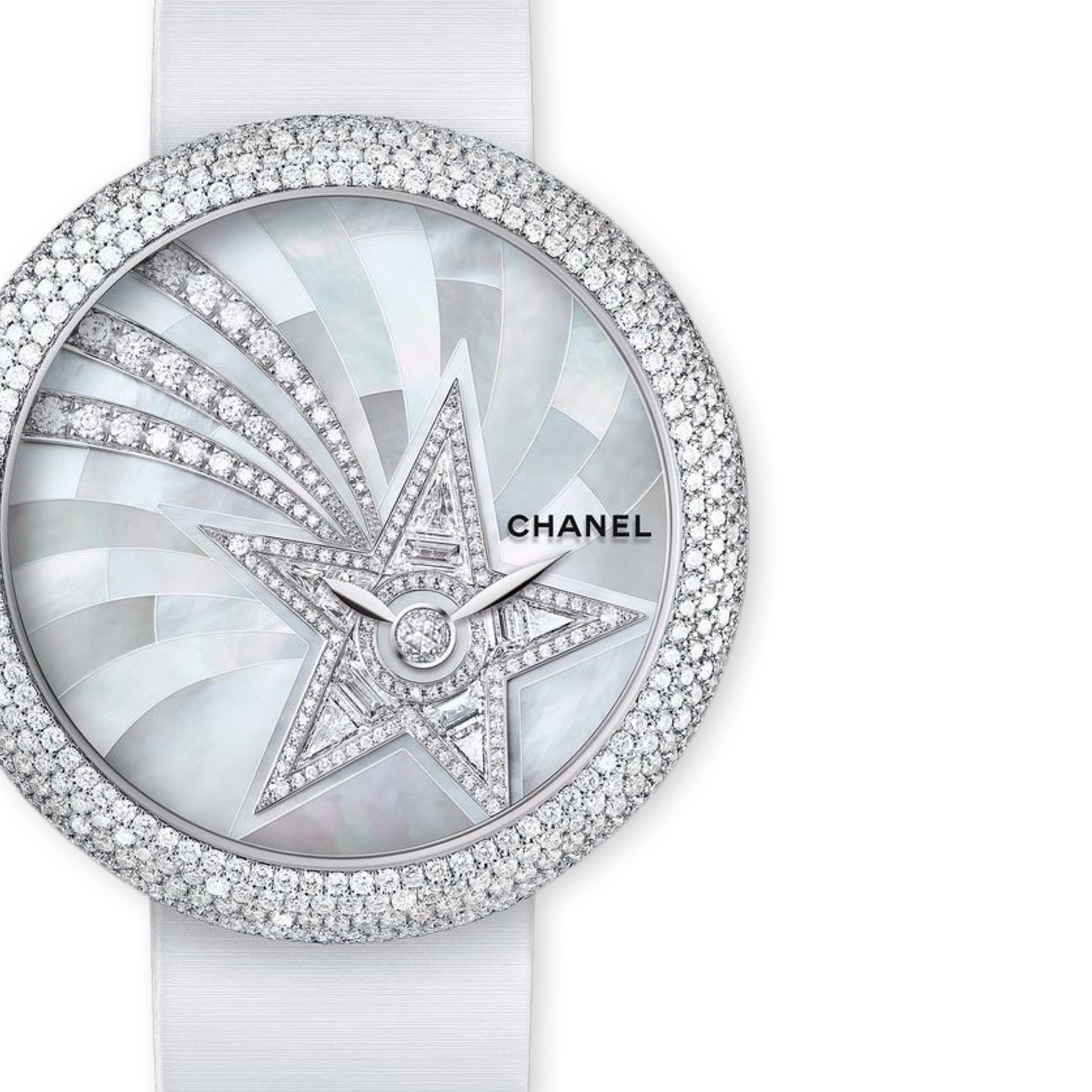 Chanel Style No: H4531
Chanel Mademoiselle Privé Quartz Watch - White Gold Diamond Case - Pearl Marquetry And Comet Motif Diamond Dial - White Satin Strap
37.5mm

18K white gold case 

570 brilliant-cut diamonds (~3.14 carats), 

9.84 mm thick,