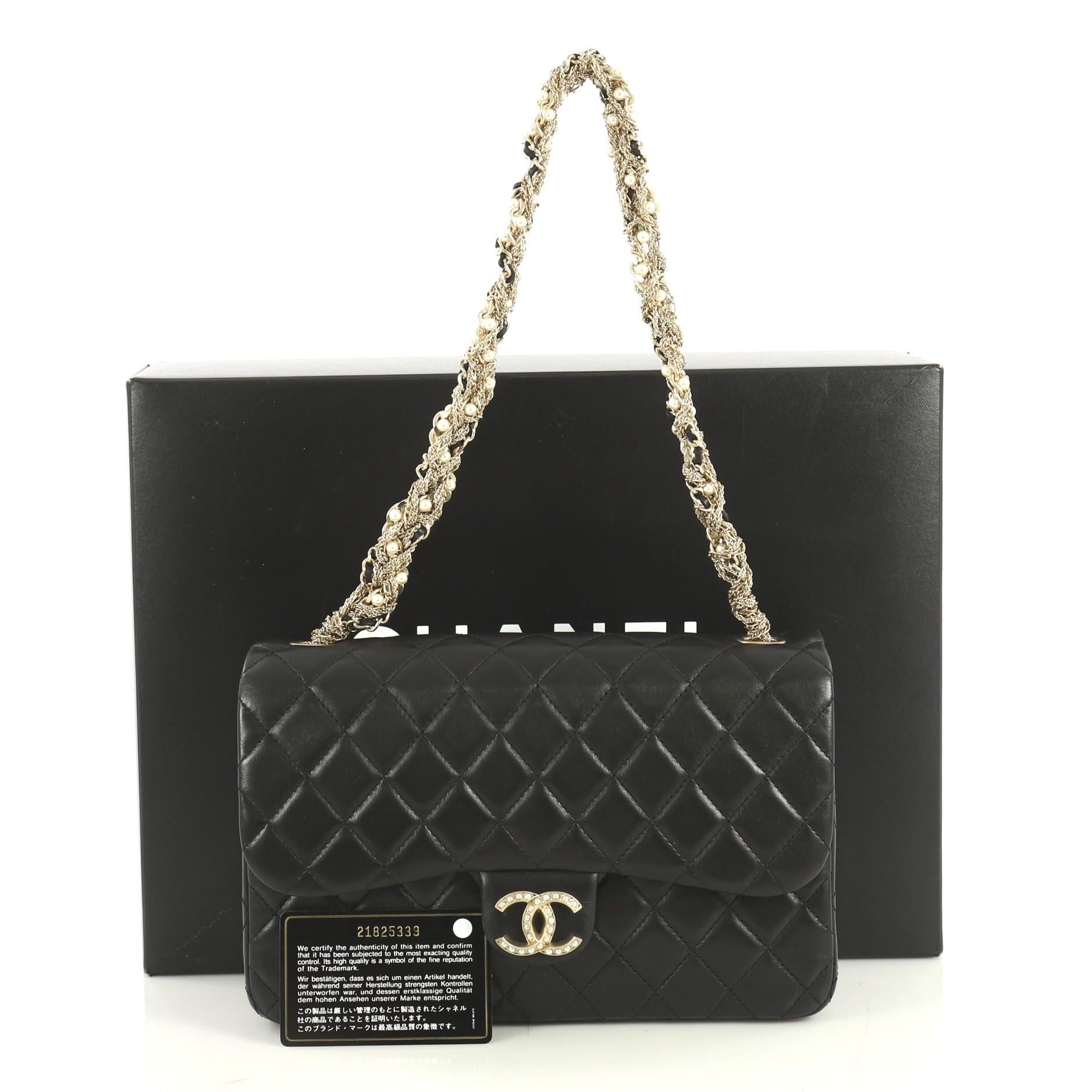This Chanel Westminster Tangled Pearl Chain Flap Bag Quilted Lambskin Medium, crafted from black quilted lambskin leather, features twisted chain and pearl strap, pearl-studded CC logo and gold-tone hardware. Its magnetic snap button closure opens
