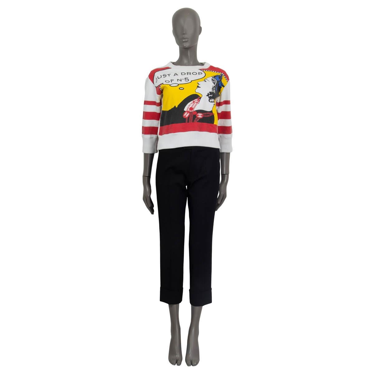 100% authentic Chanel vintage 2001 'Just a Drop of No 5' sweater in red, white, yellow, black and blue cotton (80%) and acrylic (20%). Features ribbed cuffs, round neck and a ribbed hemline. Has been worn and colour is faided, otherwise in excellent