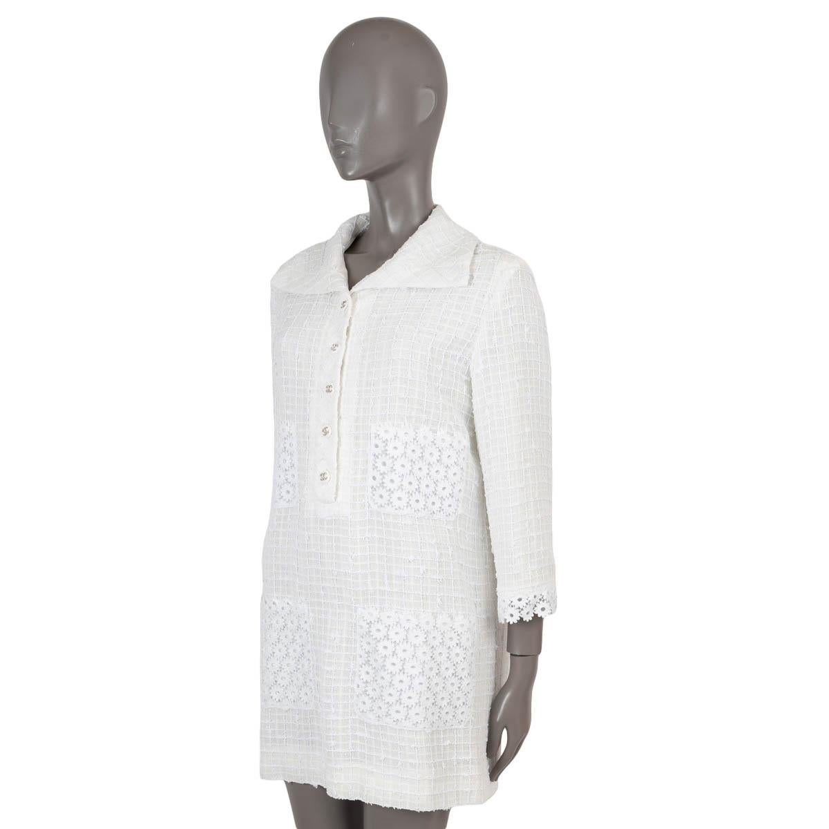 100% authentic Chanel tweed shirt dress in cream polyamide (55%), acrylic (22%), cotton (21%) and viscose (2%). Features a wide spread collar, 3/4 sleeves with floral lace cuffs and four floral lace pockets. Opens partially on the front with