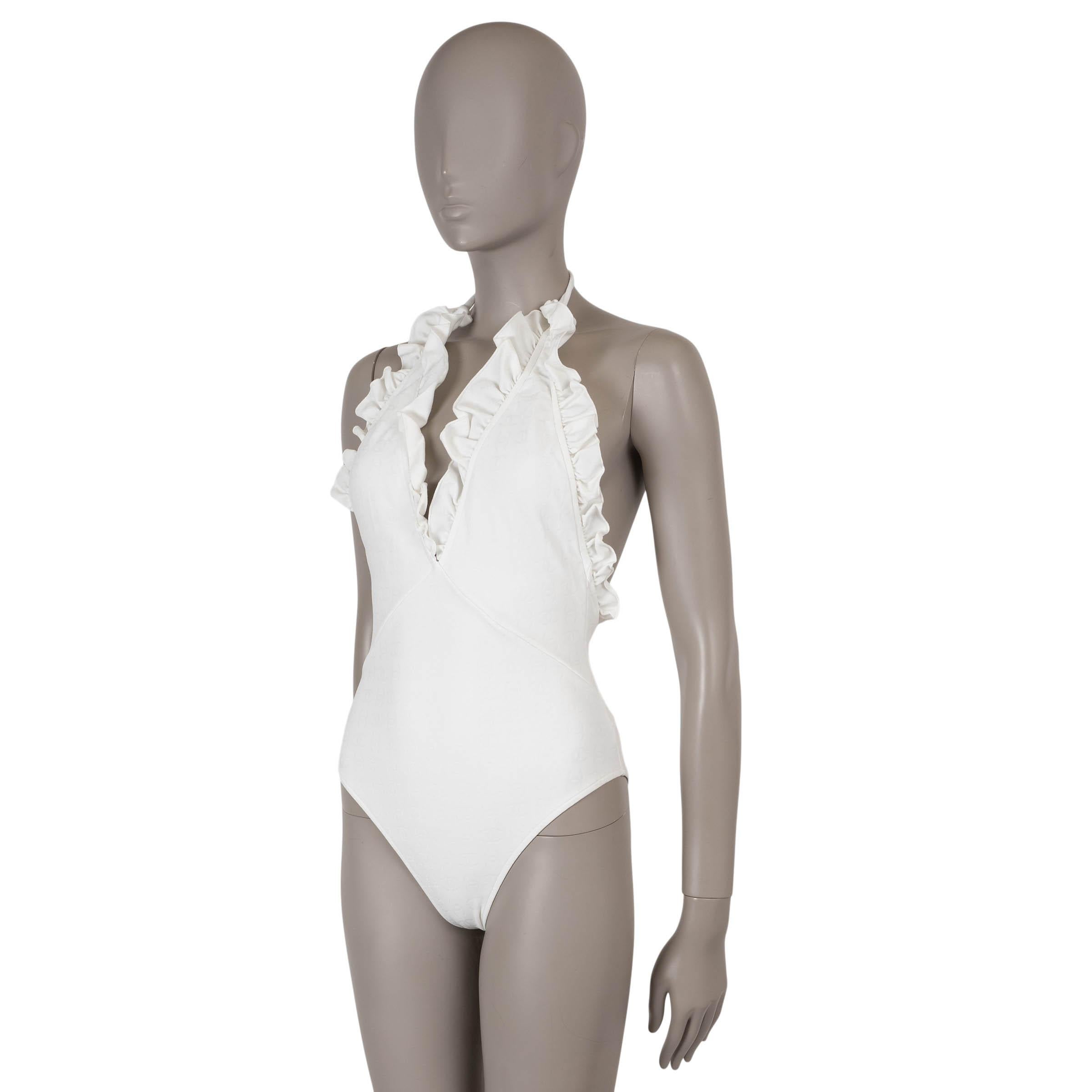 This 100% authentic Chanel white ruffle tonal CC logo swimsuit from the Summer 2023 Runway Collection is a refined yet versatile piece. Crafted from a luxurious white jersey blend of 92% polyamide and 2% elastane, it features delicate ruffles and