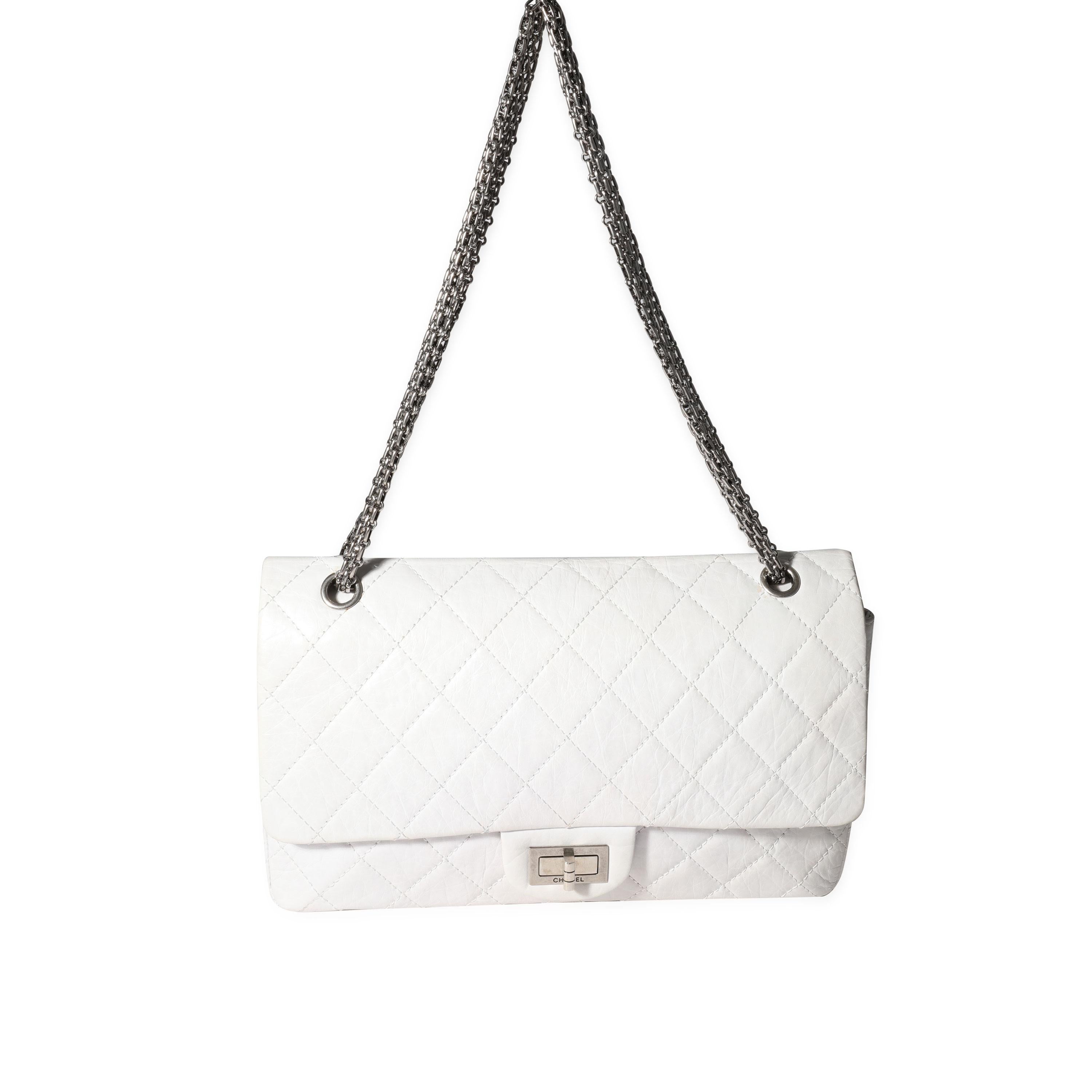 Listing Title: Chanel White Aged Calfskin Quilted 50th Anniversary 2.55 Reissue 227 Flap
SKU: 119665
Condition: Pre-owned (3000)
Handbag Condition: Good
Condition Comments: Moderate discoloration at bottom corners and edges. Light stain at interior