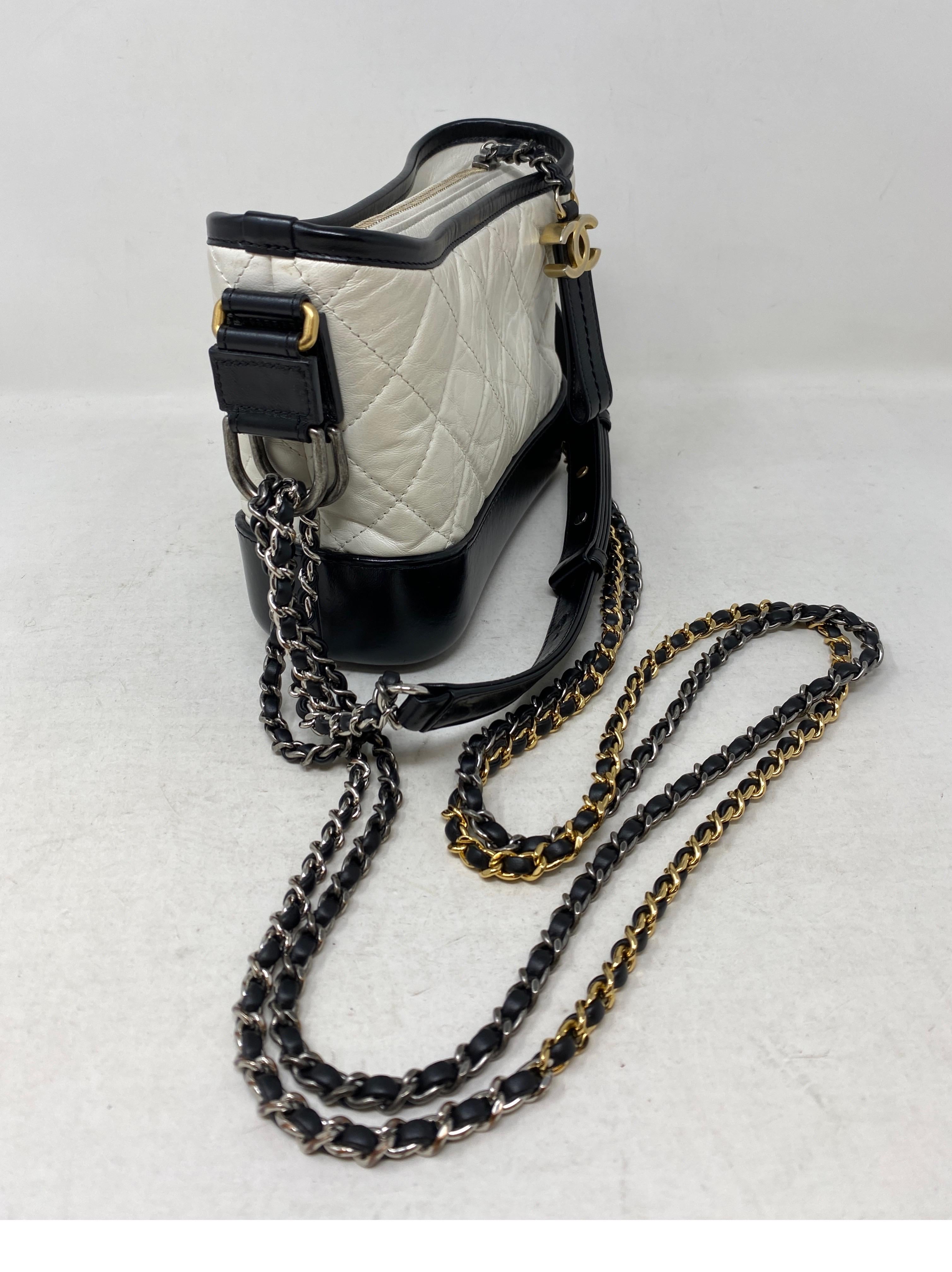 Chanel White and Black Gabrielle Bag. Good condition. Can be worn crossbody and as a shoulder bag. Small size Gabrielle bag. Includes authenticity card and dust bag. Guaranteed authentic. 