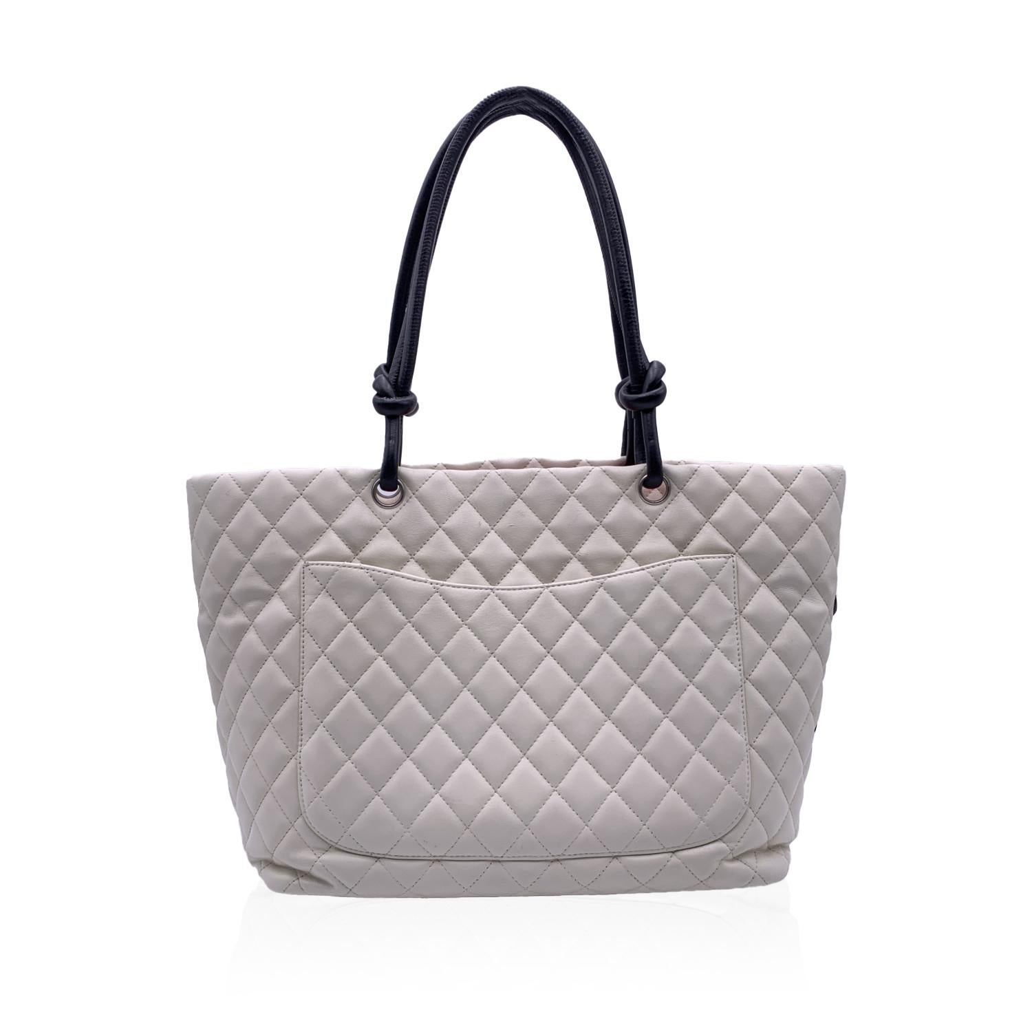 This beautiful Bag will come with a Certificate of Authenticity provided by Entrupy. The certificate will be provided at no further cost.

White tote bag from the Cambon collection by CHANEL. Period/Era: 2004-2005. White quilted leather, detailed