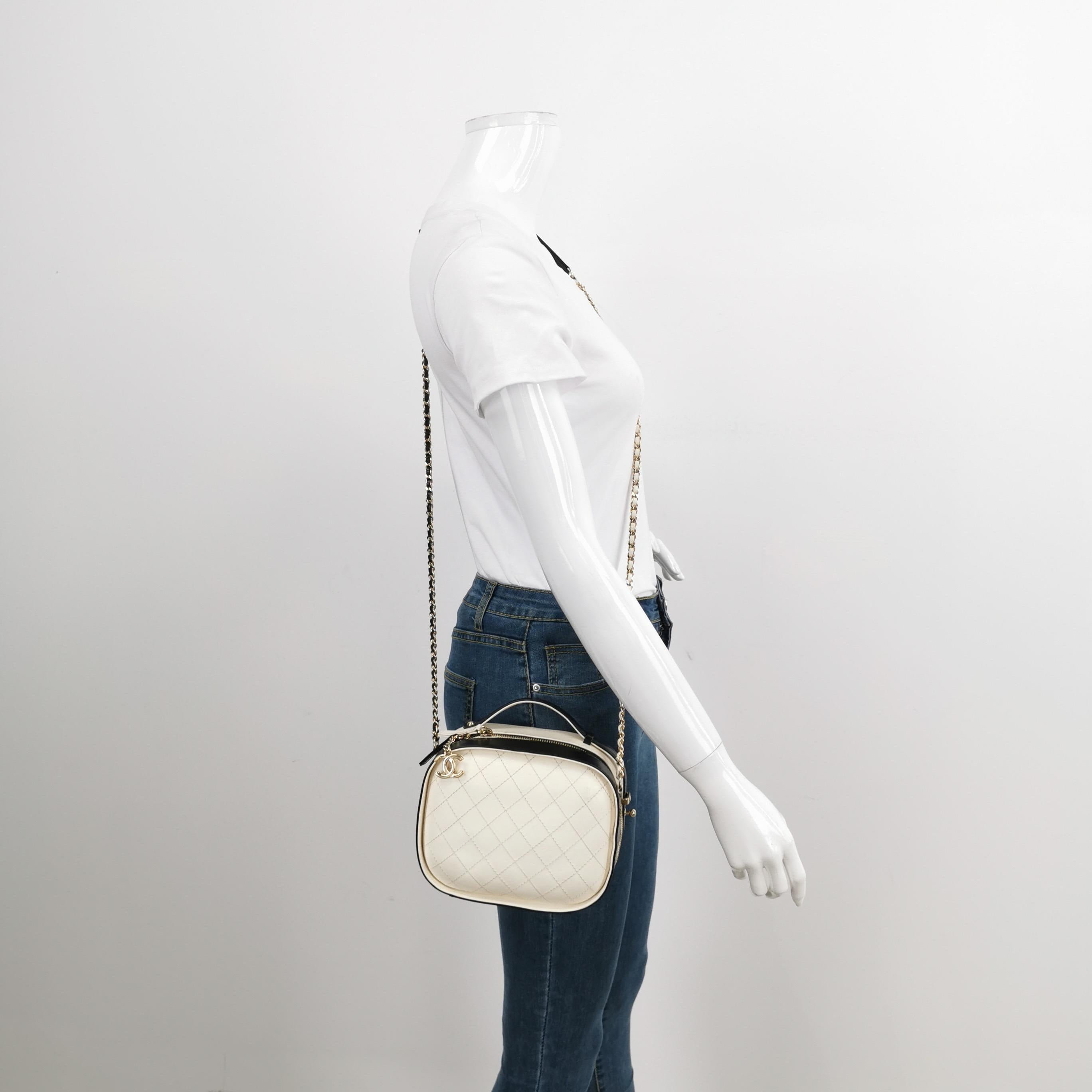 This vanity case showcases a crumpled calfskin exterior, a crossbody chain strap, a zip-top closure, and inner slip pockets.

CONDITION: EXCELLENT

This preloved authentic item is in excellent condition with scuffs on the handle, lining, and
